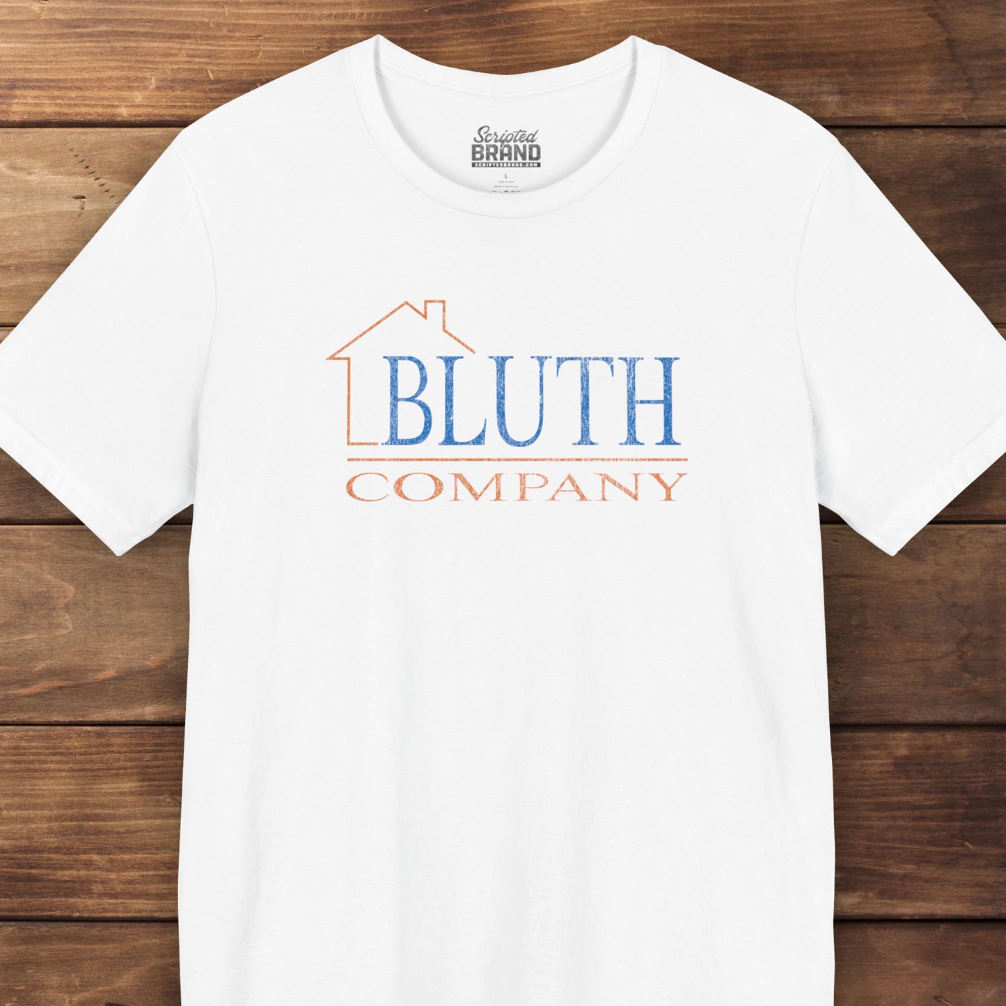 Front view of white Bella+Canvas t-shirt featuring a vintage Bluth Company logo inspired by the TV show Arrested Development.