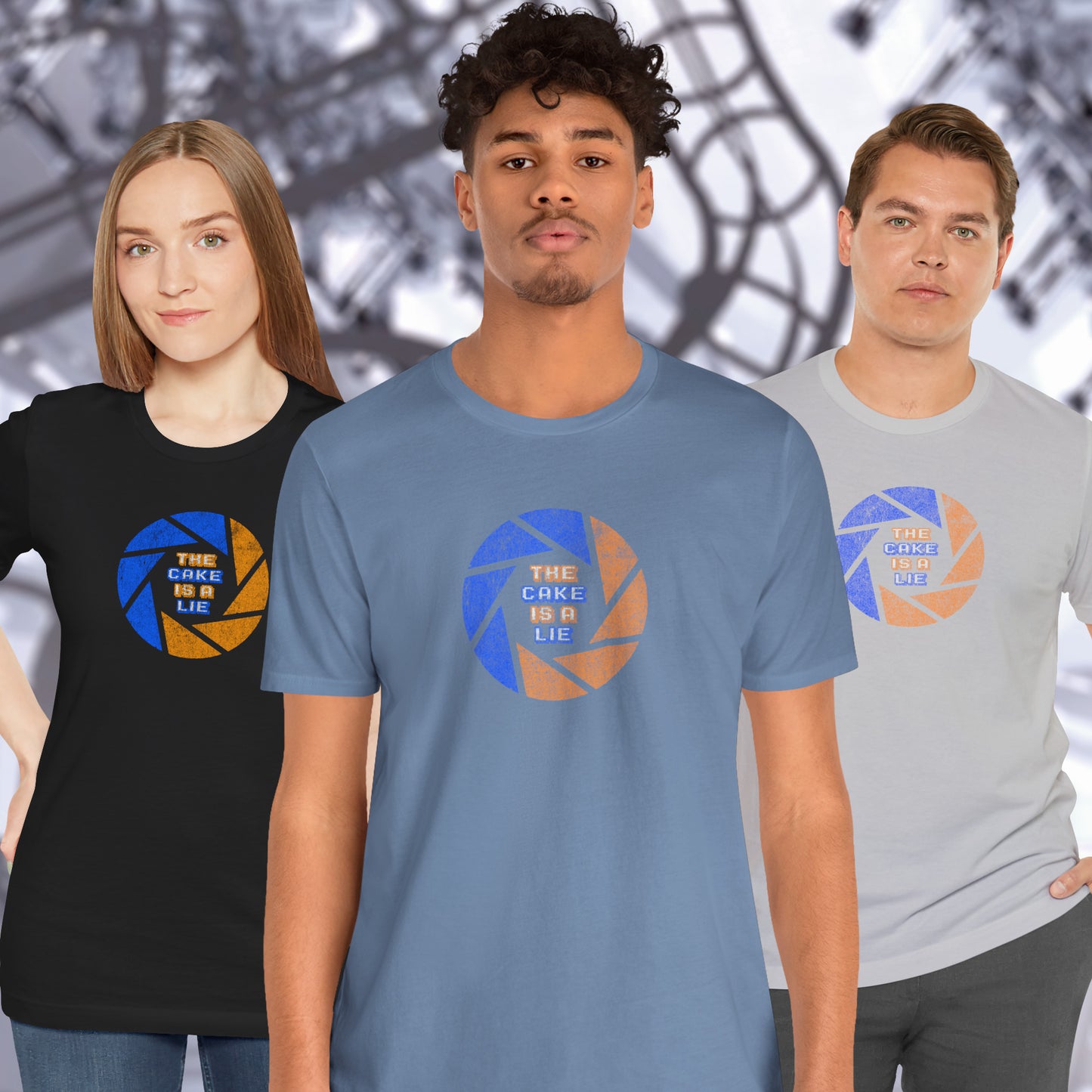 3 models wearing soft Bella+Canvas 3001 short-sleeve t-shirts featuring the phrase The Cake Is a Lie, along with the Aperture Laboratories shutter logo from the video game Portal and Portal 2 in a vintage distressed style, sold by ScriptedBrand.