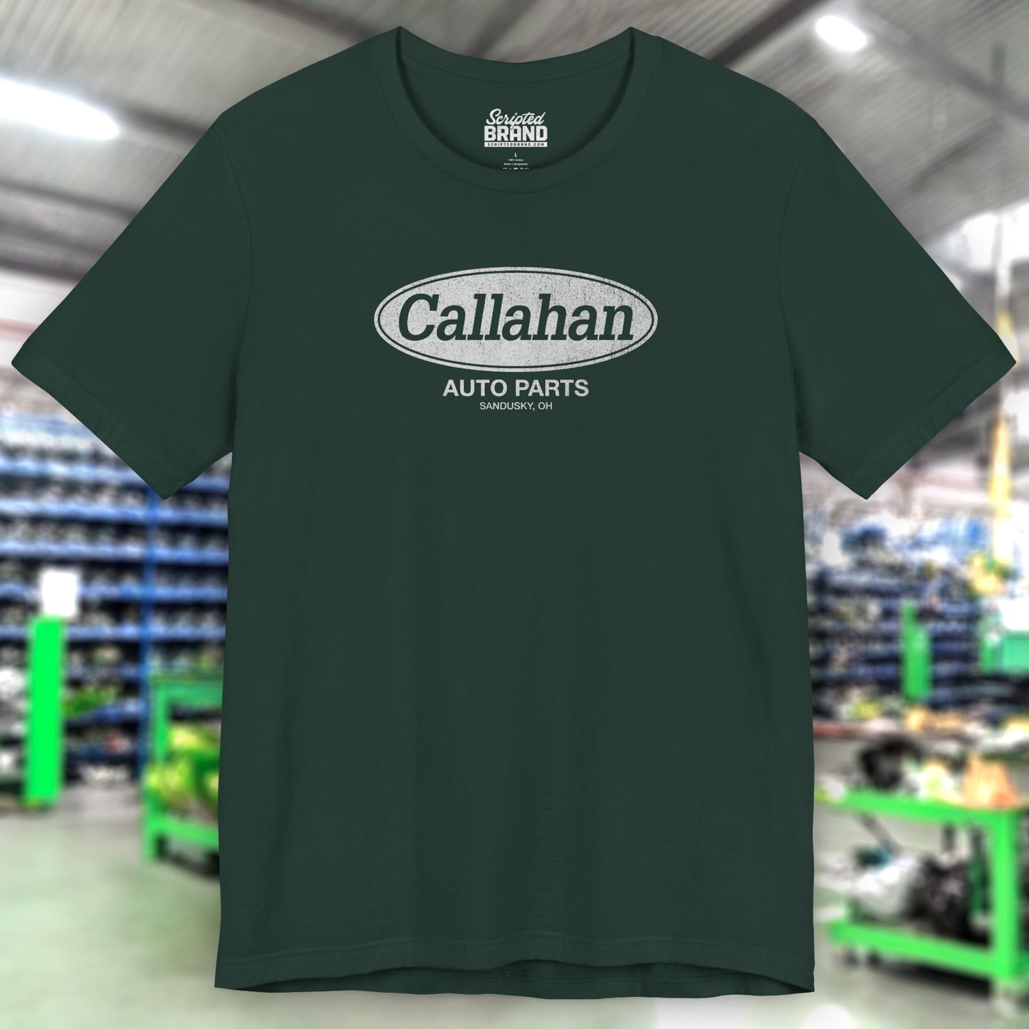 Front view of a Forest Green colored soft short-sleeve t-shirt with the Callahan Auto Parts logo from the movie Tommy Boy in a vintage distressed style.