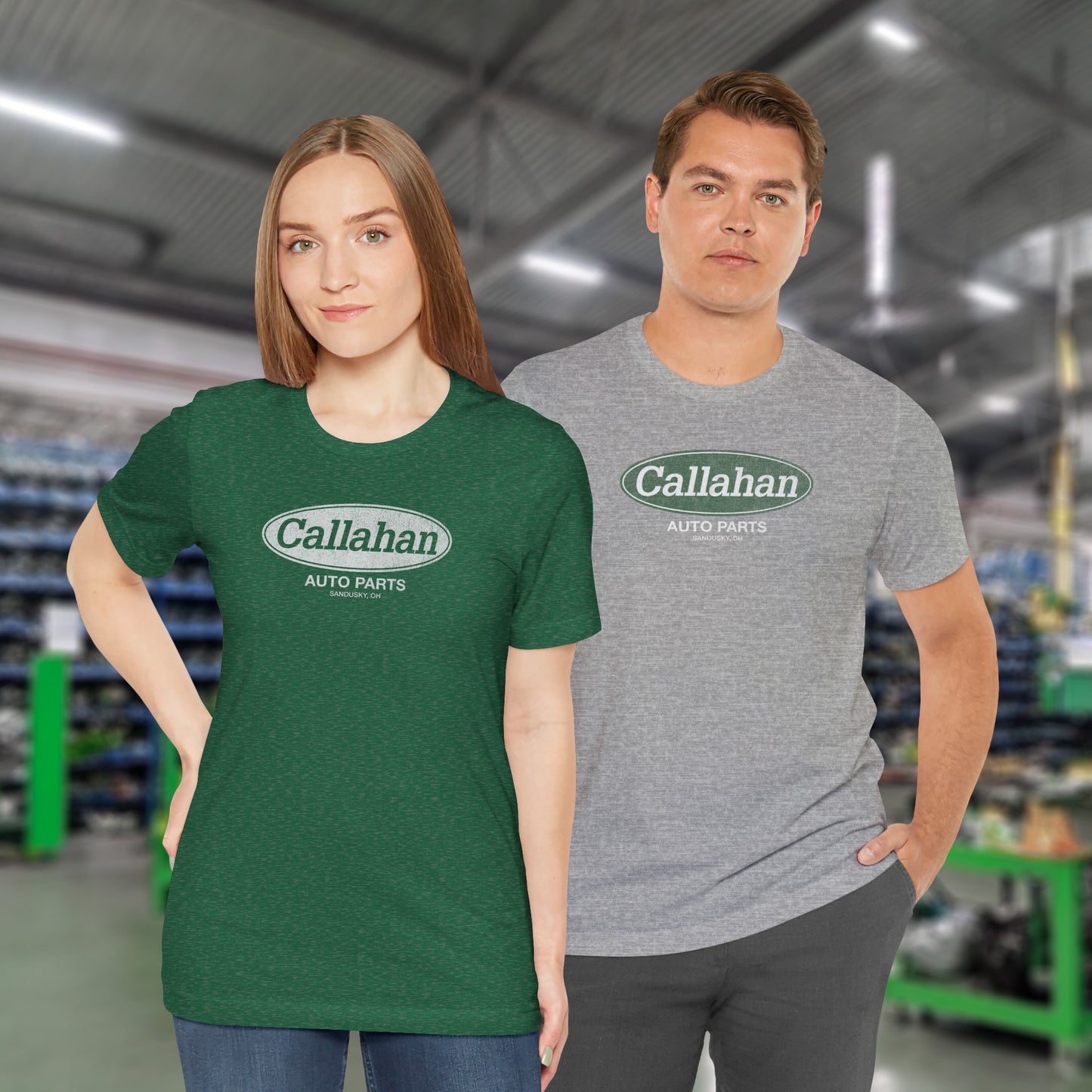 2 models wearing soft short-sleeve t-shirts with the Callahan Auto Parts logo from the movie Tommy Boy in a vintage distressed style.
