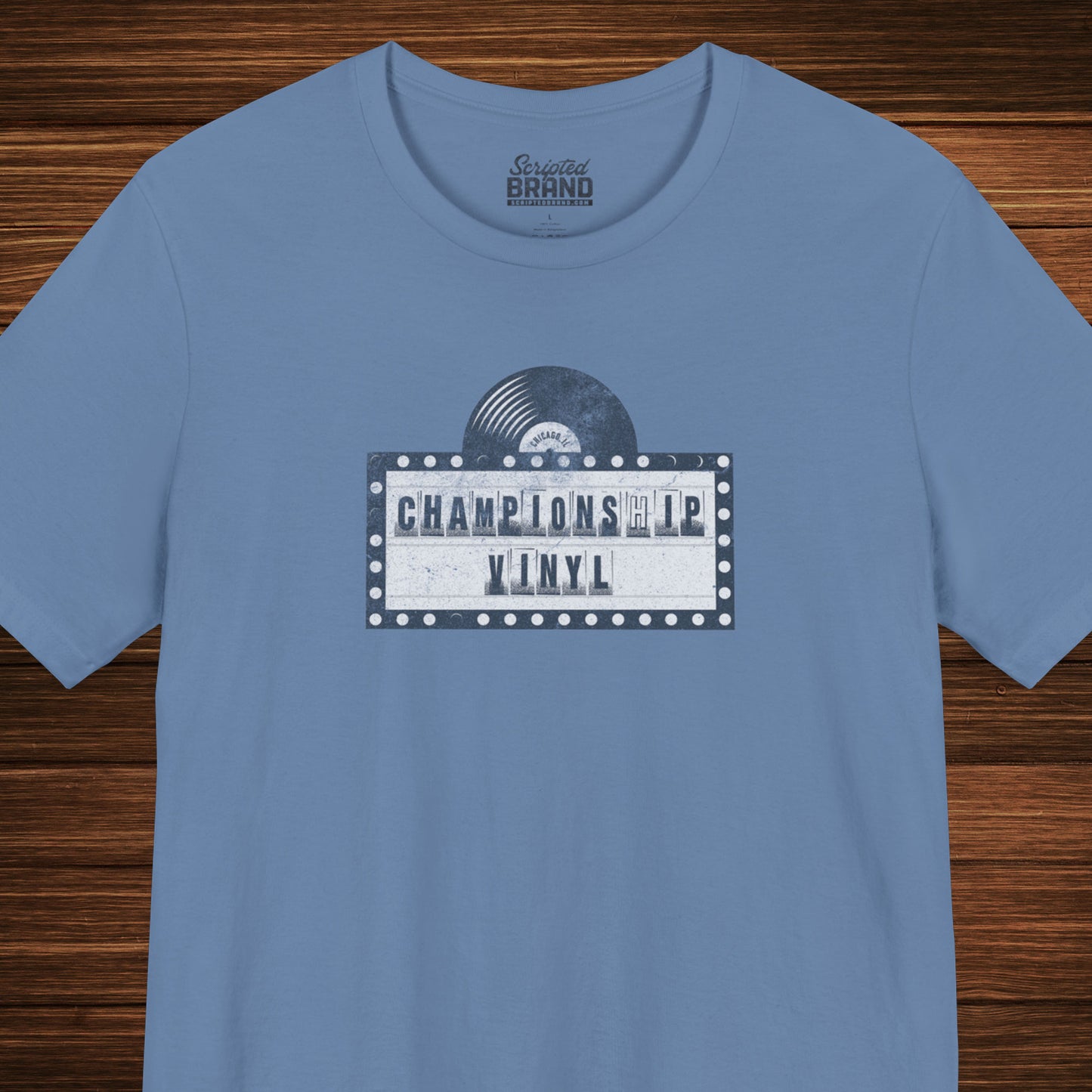 Blue t-shirt featuring the fictional logo CHAMPIONSHIP VINYL record store from movie High Fidelity in a vintage distressed style.