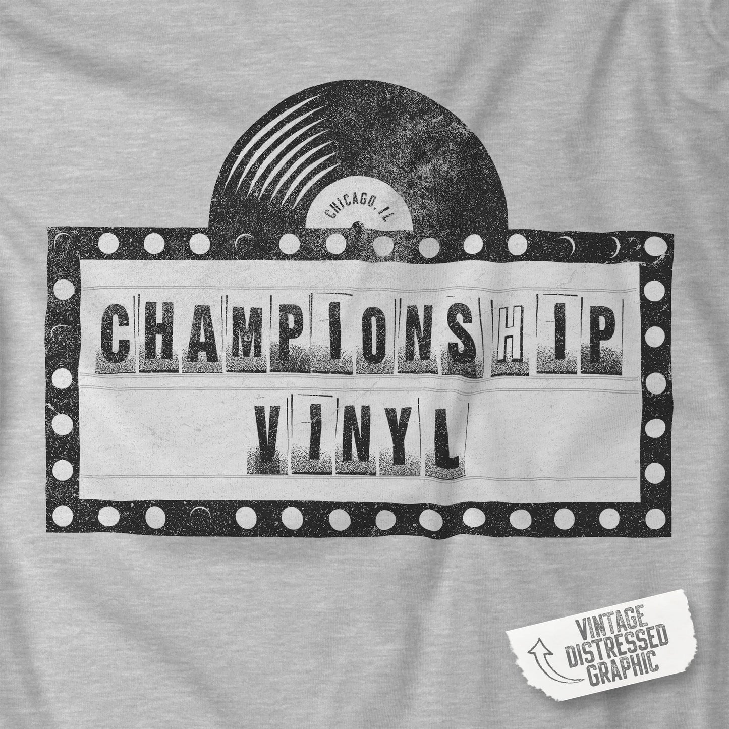 Closeup of Heather Gray t-shirt featuring the fictional logo CHAMPIONSHIP VINYL record store from movie High Fidelity in a vintage distressed style.