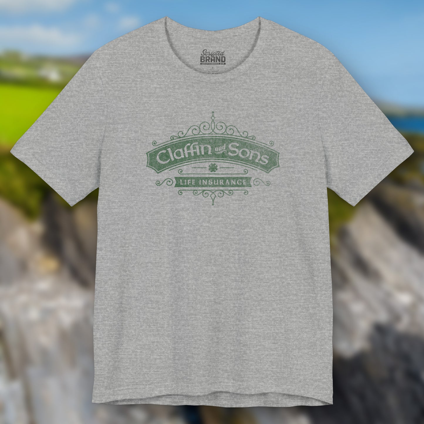 Front view of an athletic heather grey colored soft Bella+Canvas 3001 short-sleeve t-shirt featuring a logo graphic of Claffin & Sons Insurance, designed by ScriptedBrand in a vintage distressed vintage distressed style, inspired by the TV show Bad Sisters.