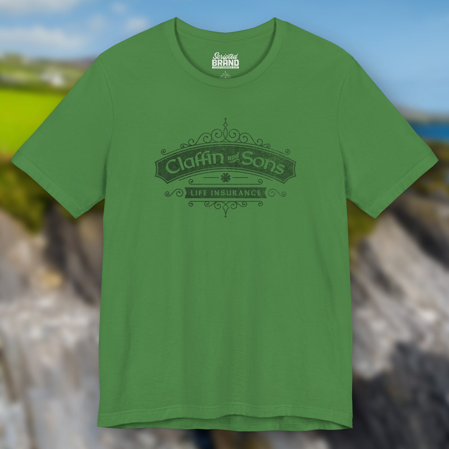 Front view of a leaf green colored soft Bella+Canvas 3001 short-sleeve t-shirt featuring a logo graphic of Claffin & Sons Insurance, designed by ScriptedBrand in a vintage distressed vintage distressed style, inspired by the TV show Bad Sisters.