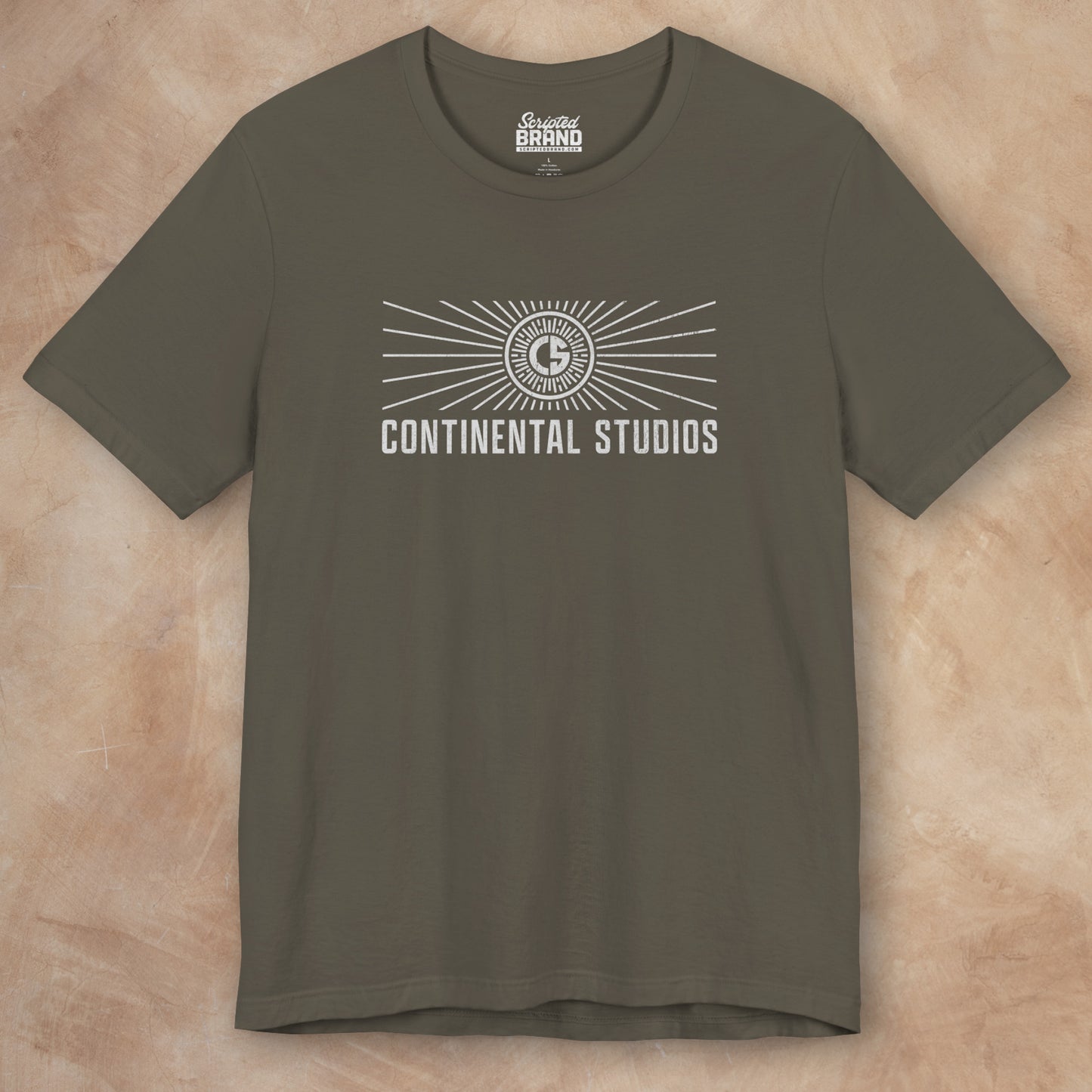 Front view of an army green colored Soft Bella+Canvas 3001 short-sleeve t-shirt featuring the logo graphic of the fictional movie studio Continental Studios inspired by the Apple TV show The Studio in a vintage distressed style, sold by ScriptedBrand.