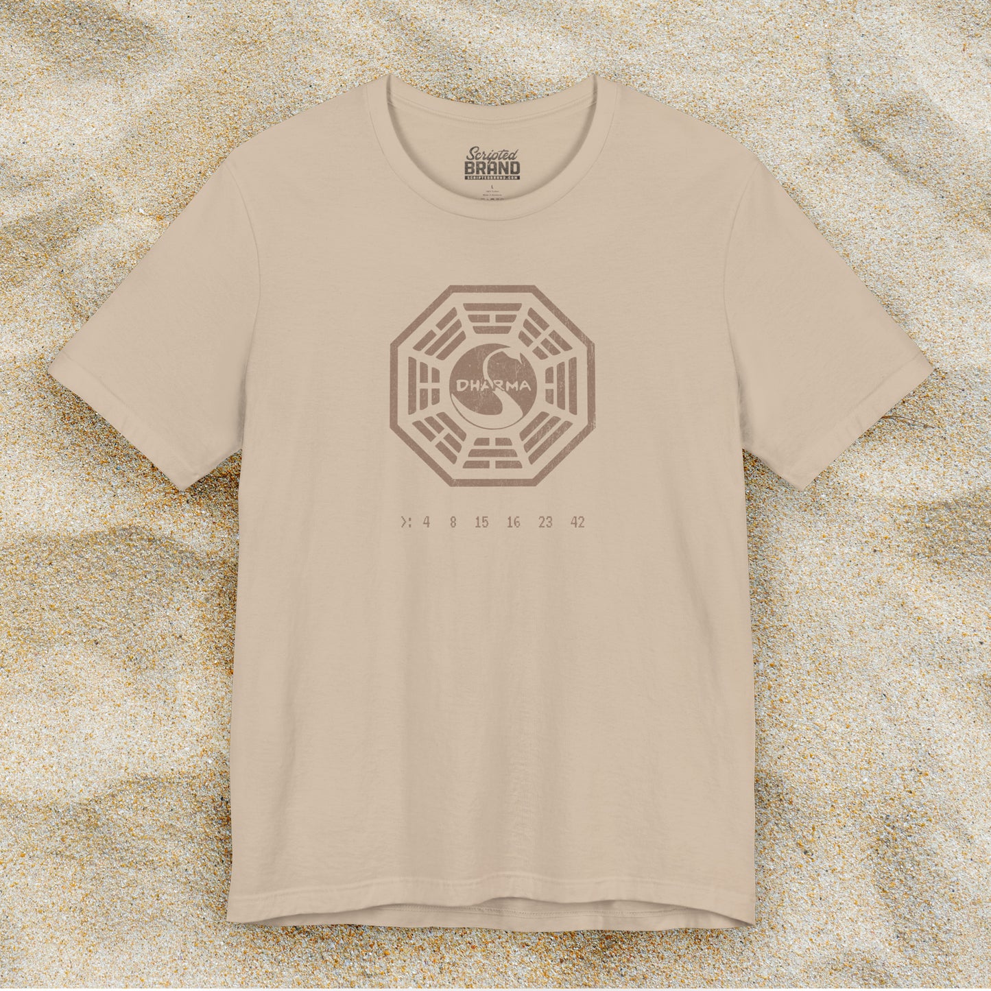 Tan short-sleeve t-shirt featuring the Dharma Initiative swan station logo graphic from the TV show LOST in a vintage distressed style.