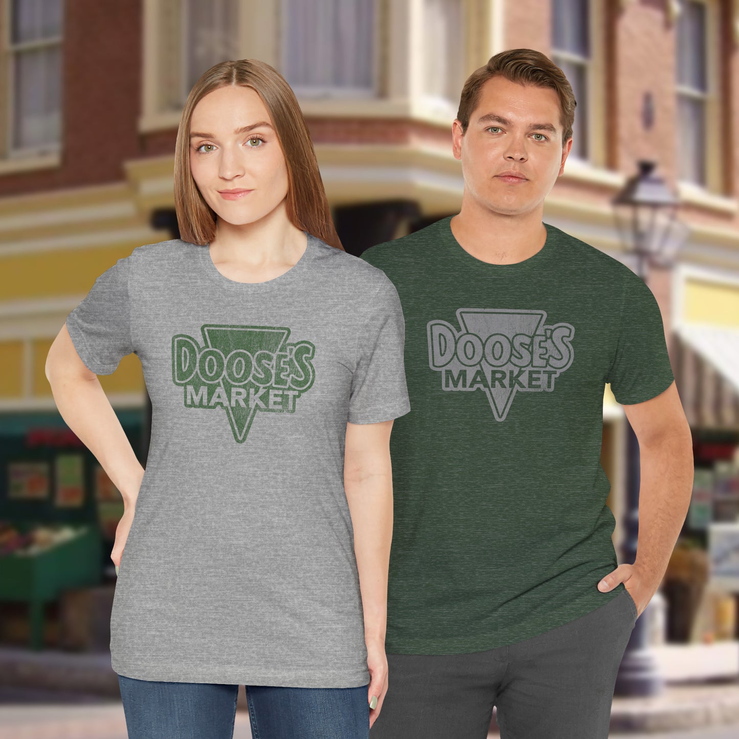 2 people wearing Bella+Canvas t-shirts with a vintage-style Doose’s Market logo graphic, inspired by Gilmore Girls.