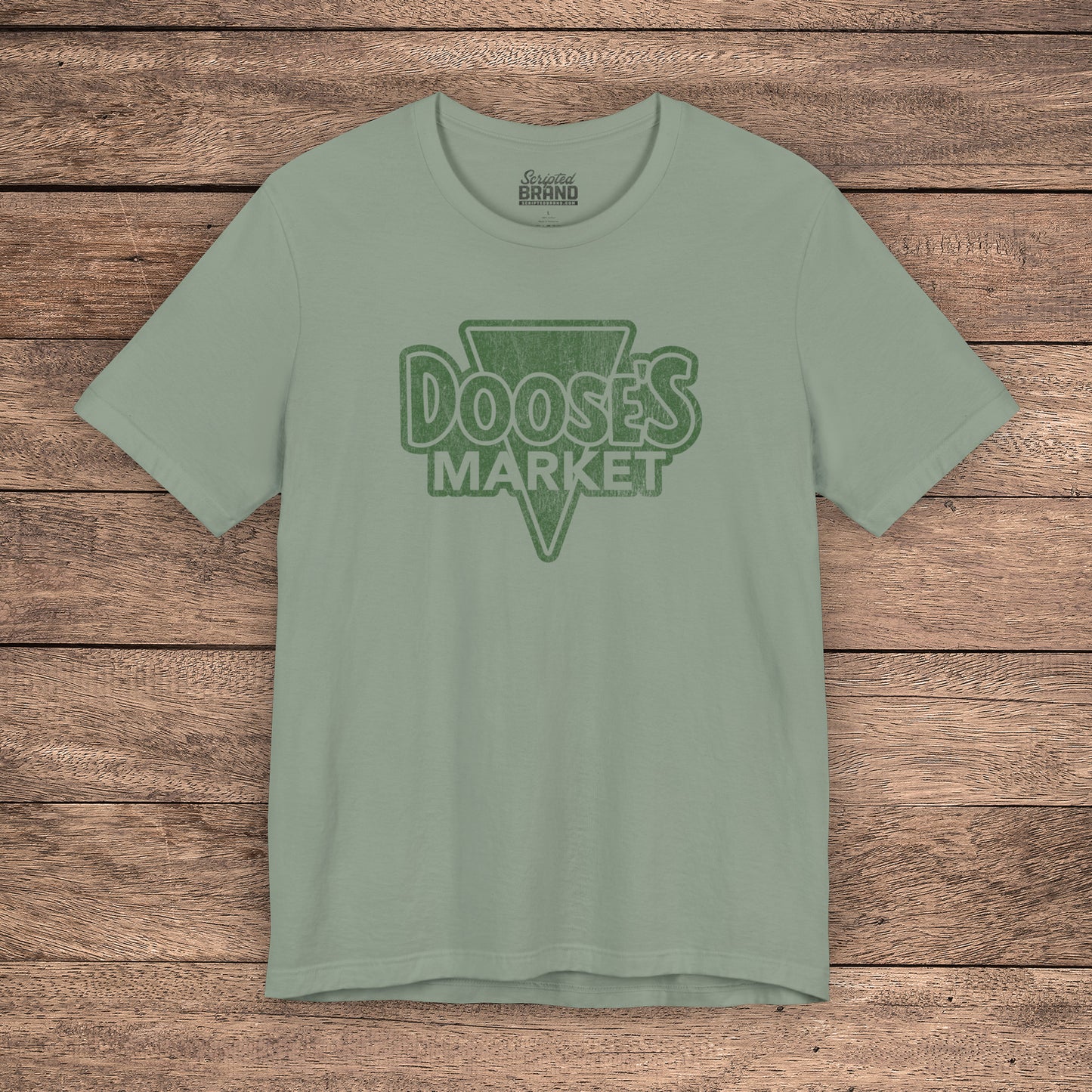 Sage green Bella+Canvas t-shirt with a vintage-style Doose’s Market logo graphic, inspired by Gilmore Girls