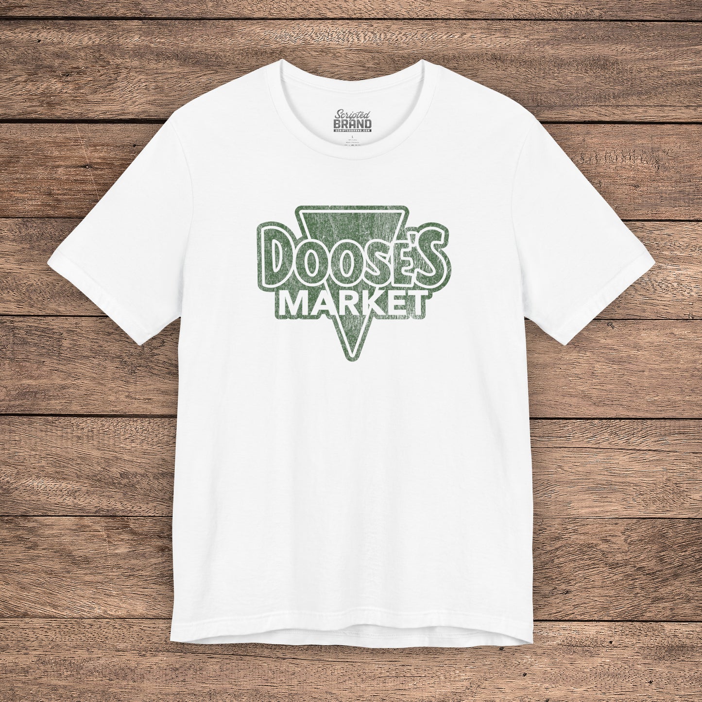White Bella+Canvas t-shirt with a vintage-style Doose’s Market logo graphic in green, inspired by Gilmore Girls