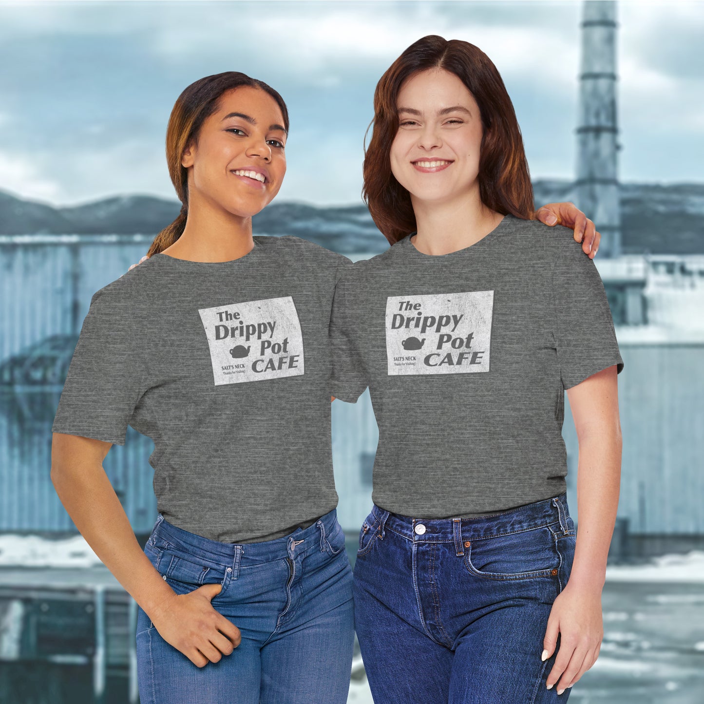 2 female models wearing Bella+Canvas short-sleeve t-shirts featuring vintage Drippy Pot Café logo from Severance TV show, unisex fit