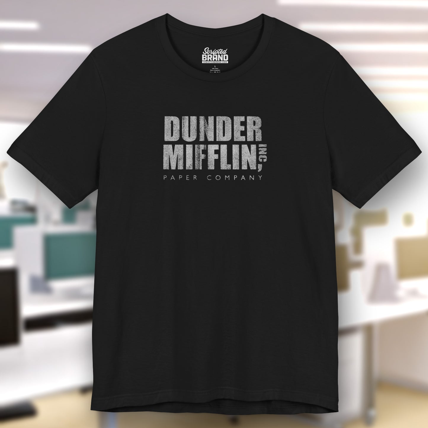 Black t-shirt featuring the Dunder Mifflin logo from the TV show The Office in a vintage distressed style.