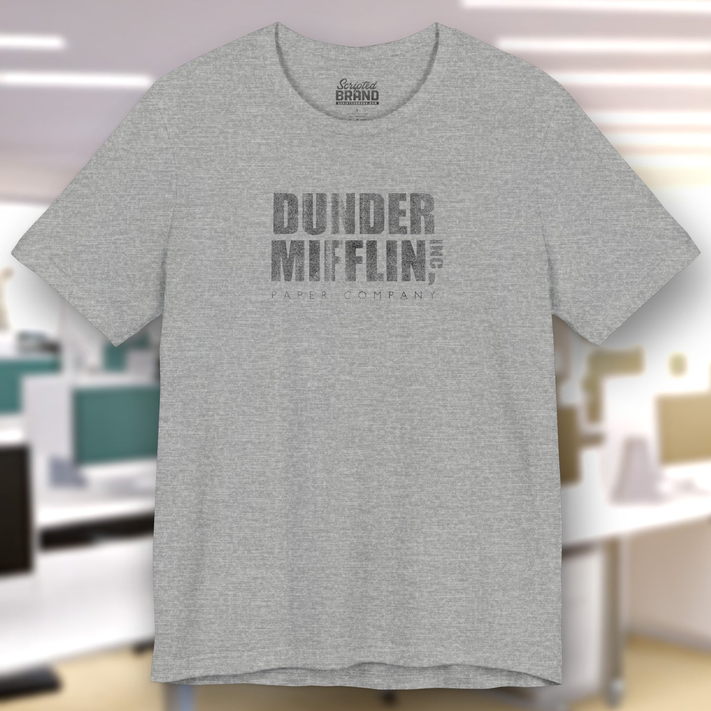 Heather Gray t-shirt featuring the Dunder Mifflin logo from the TV show The Office in a vintage distressed style.