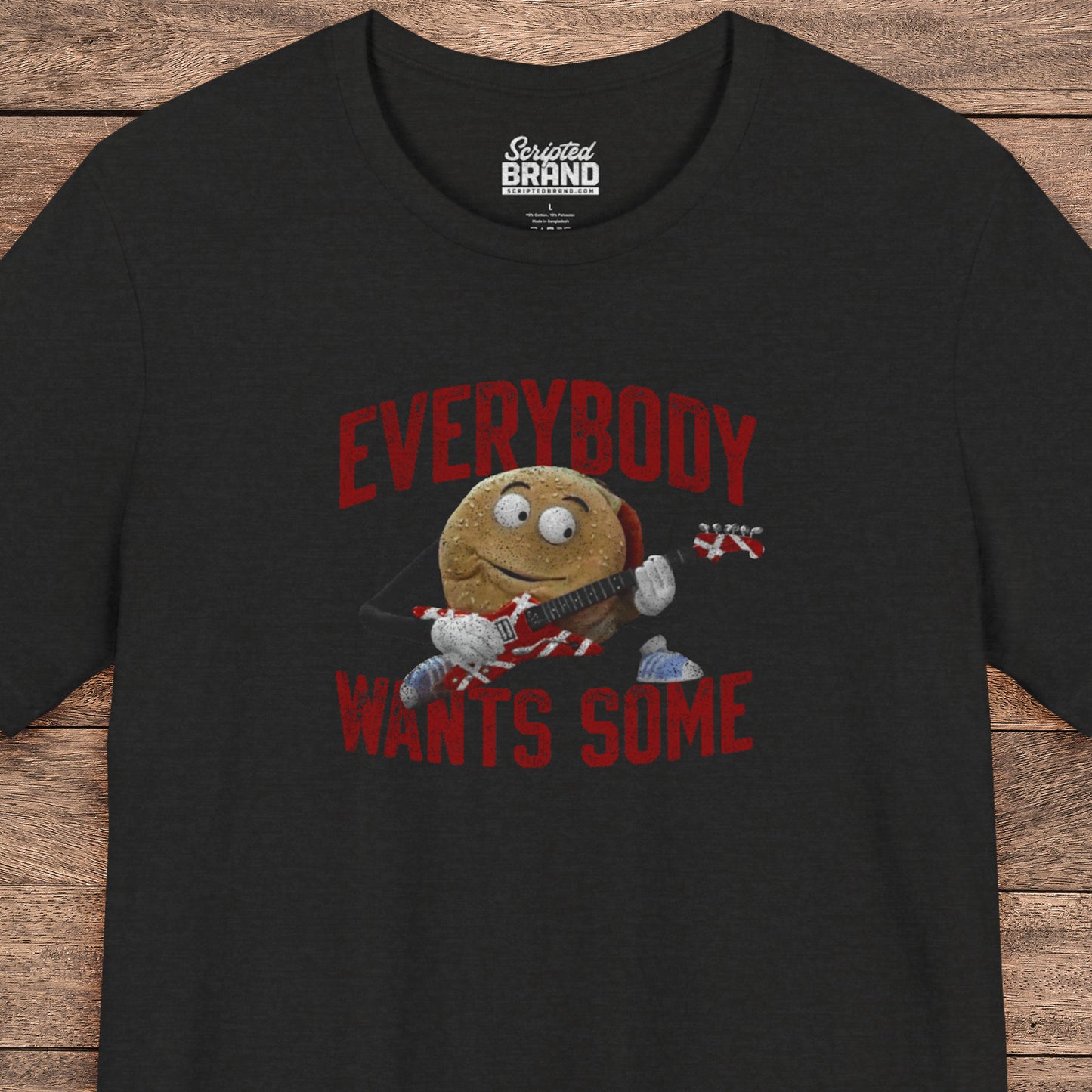 Black t-shirt with the phrase EVERYBODY WANTS SOME and a graphic of the guitar playing hamburger from the movie Better Off Dead in a vintage style.