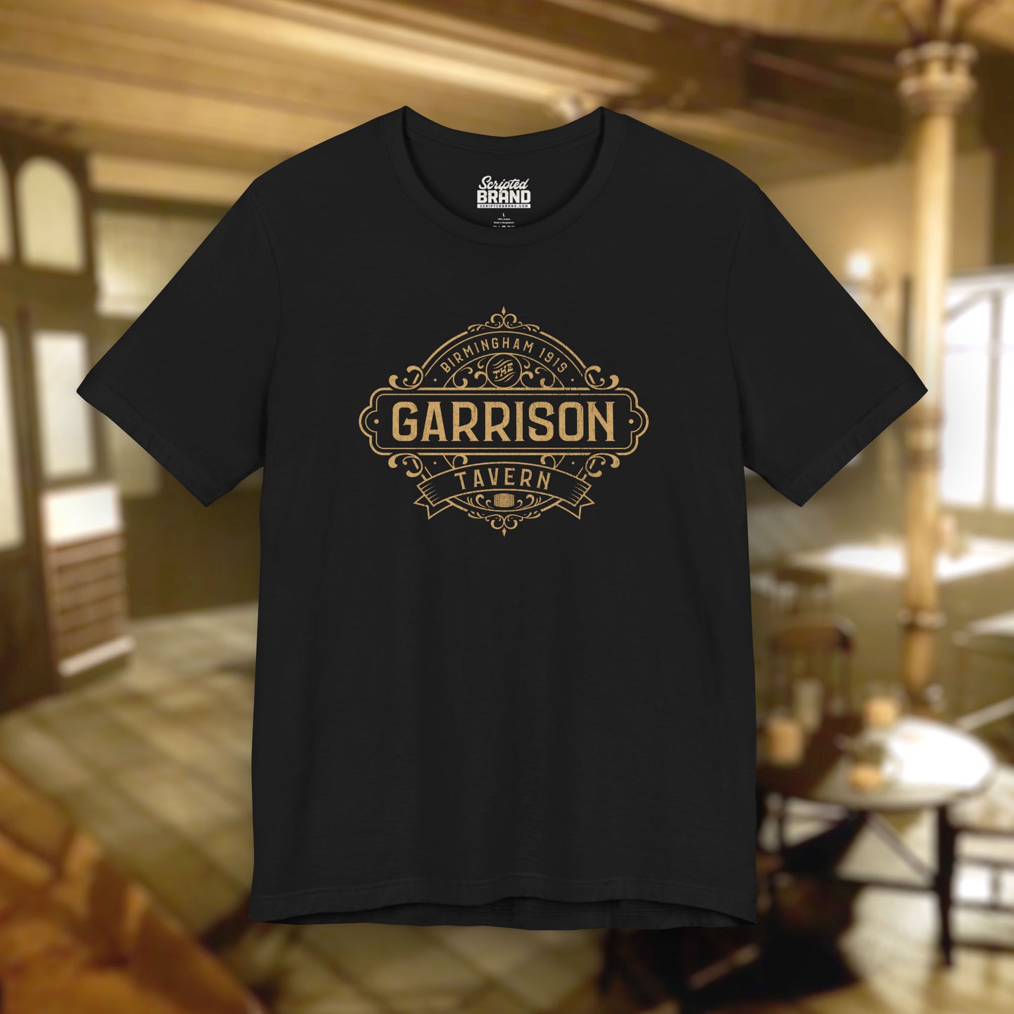 Front view of a black soft Bella+Canvas 3001 short-sleeve t-shirt featuring the Garrison Tavern Bar Logo Graphic inspired by the TV show and movie Peaky Blinders in a vintage distressed style, sold by ScriptedBrand.