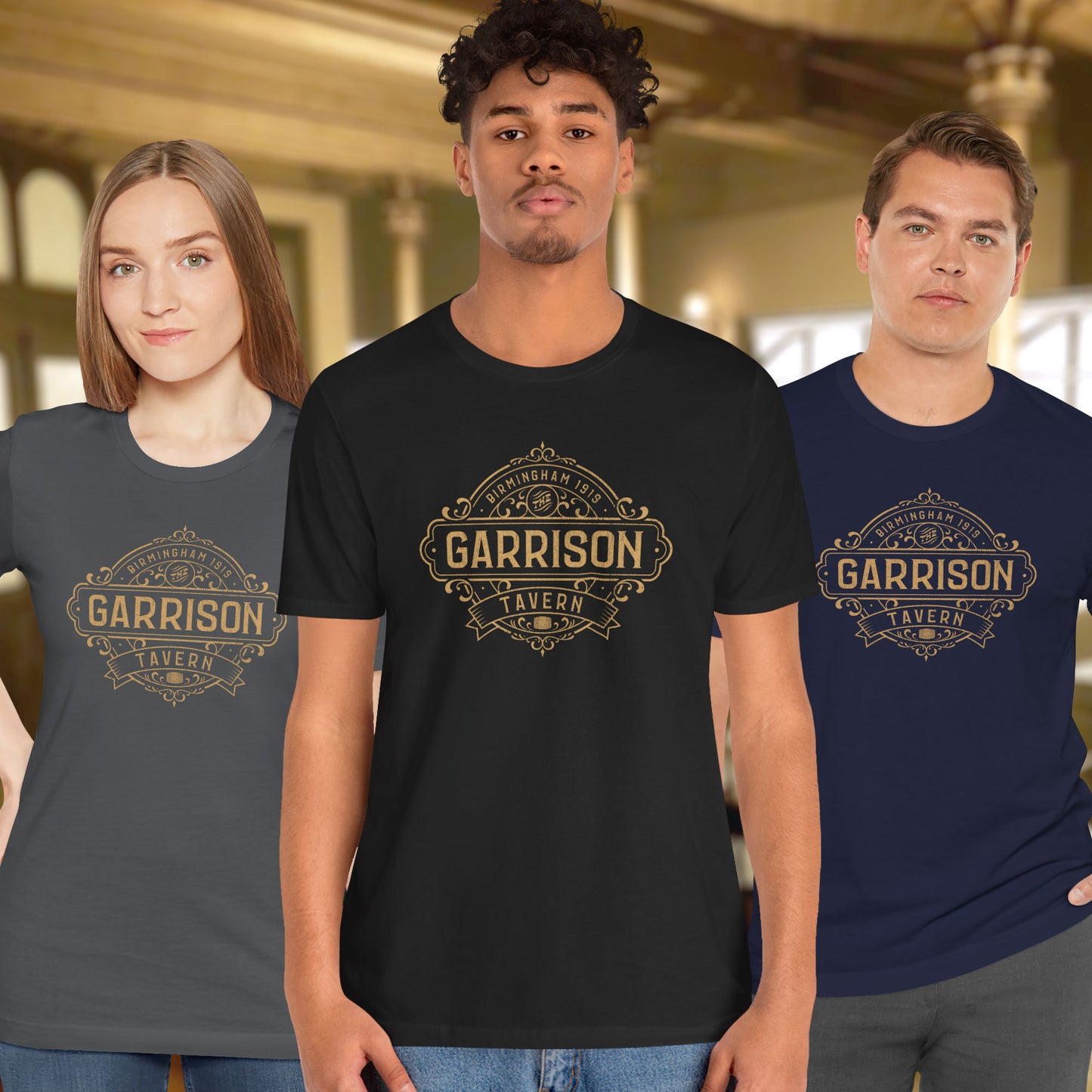 3 models wearing soft Bella+Canvas 3001 short-sleeve t-shirts featuring the Garrison Tavern Bar Logo Graphic inspired by the TV show and movie Peaky Blinders in a vintage distressed style, sold by ScriptedBrand.