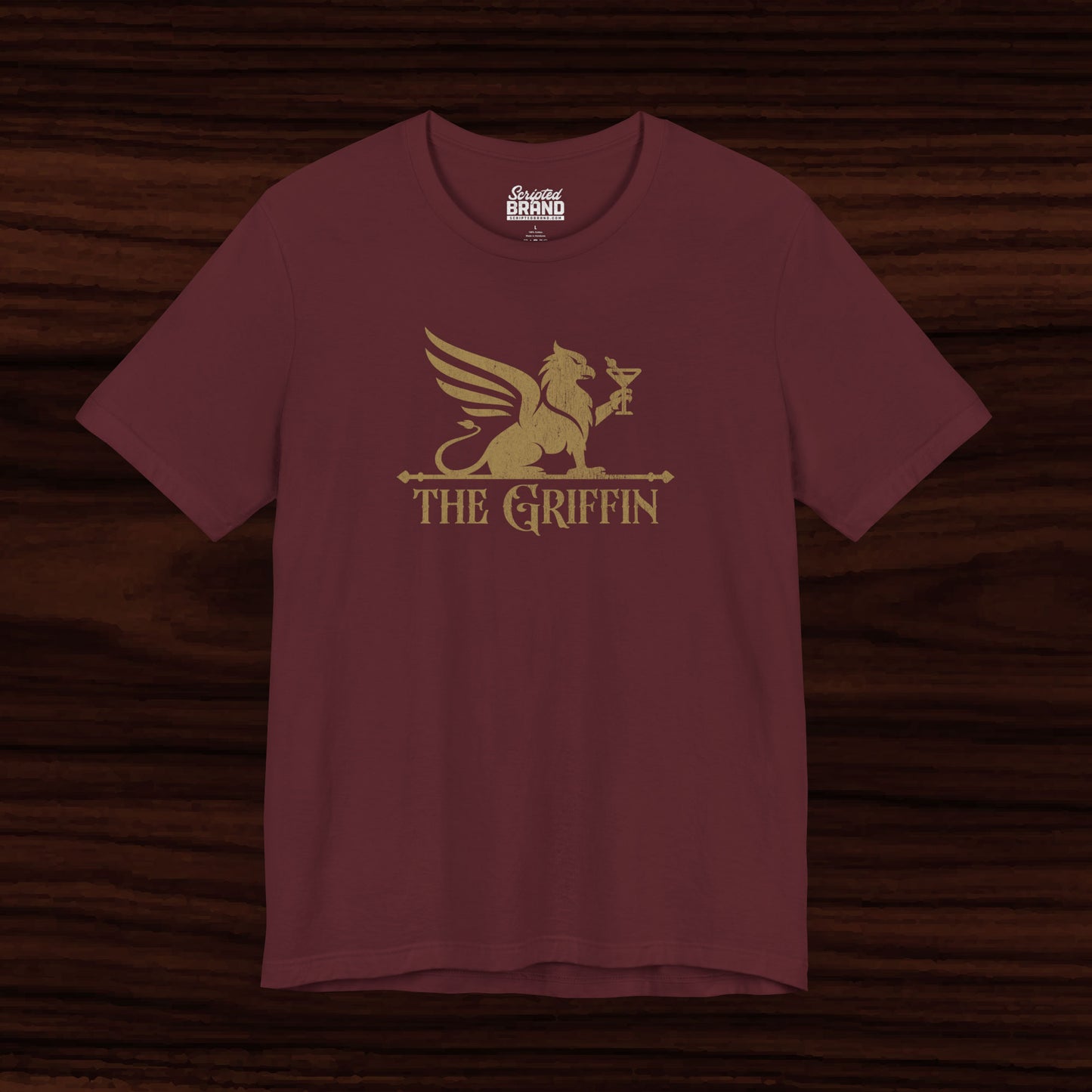 Maroon t-shirt featuring gold 'The Griffin' Bar logo inspired by the TV show New Girl in a vintage distressed style.