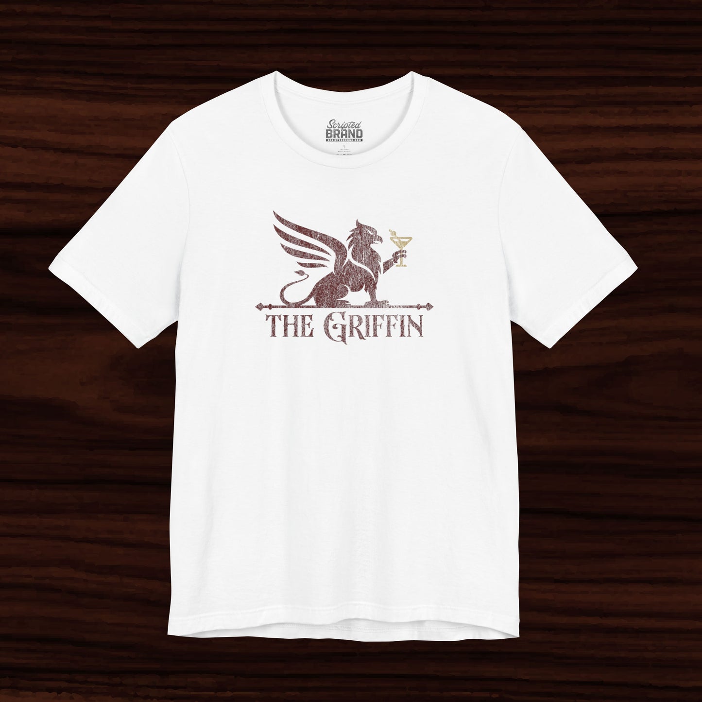 White t-shirt featuring maroon 'The Griffin' Bar logo inspired by the TV show New Girl in a vintage distressed style.