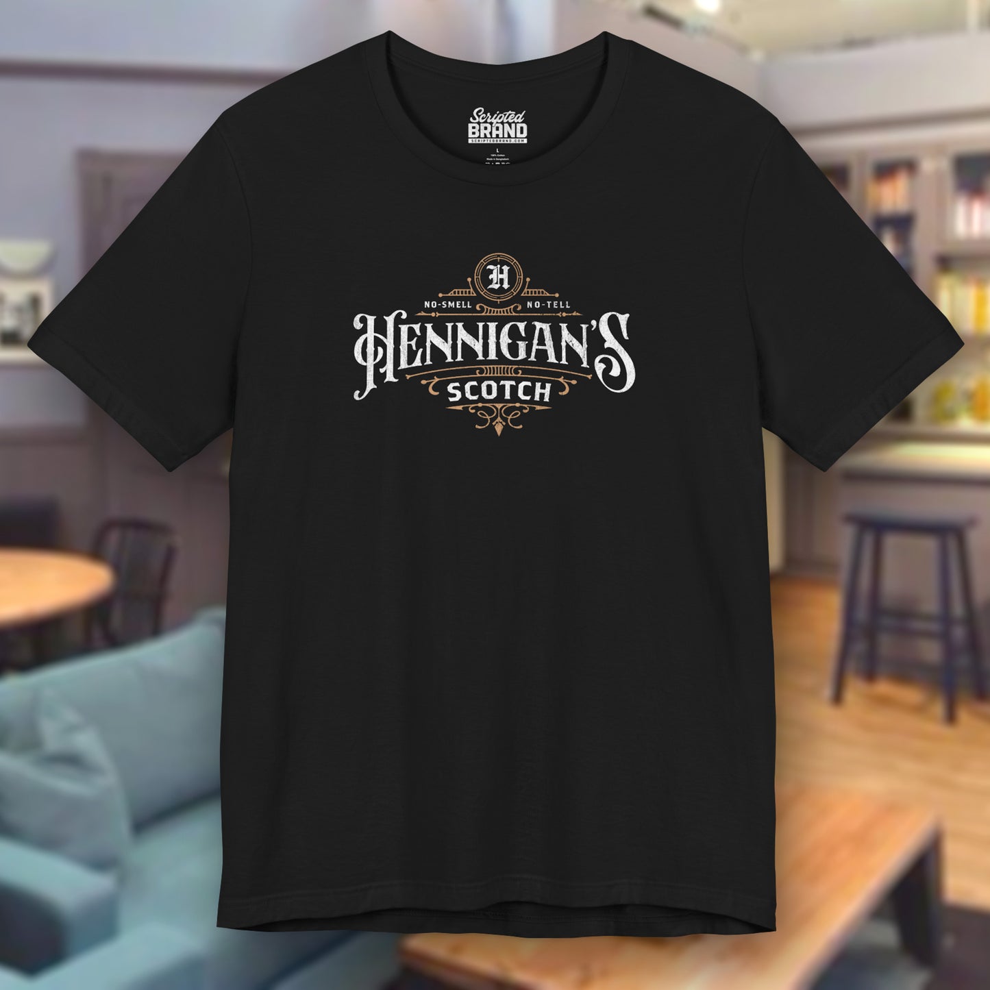 Black colored soft short-sleeve t-shirt featuring a Hennigans Scotch Whisky logo graphic inspired by the TV show Seinfeld in a vintage distressed ink-stamped worn-in style.