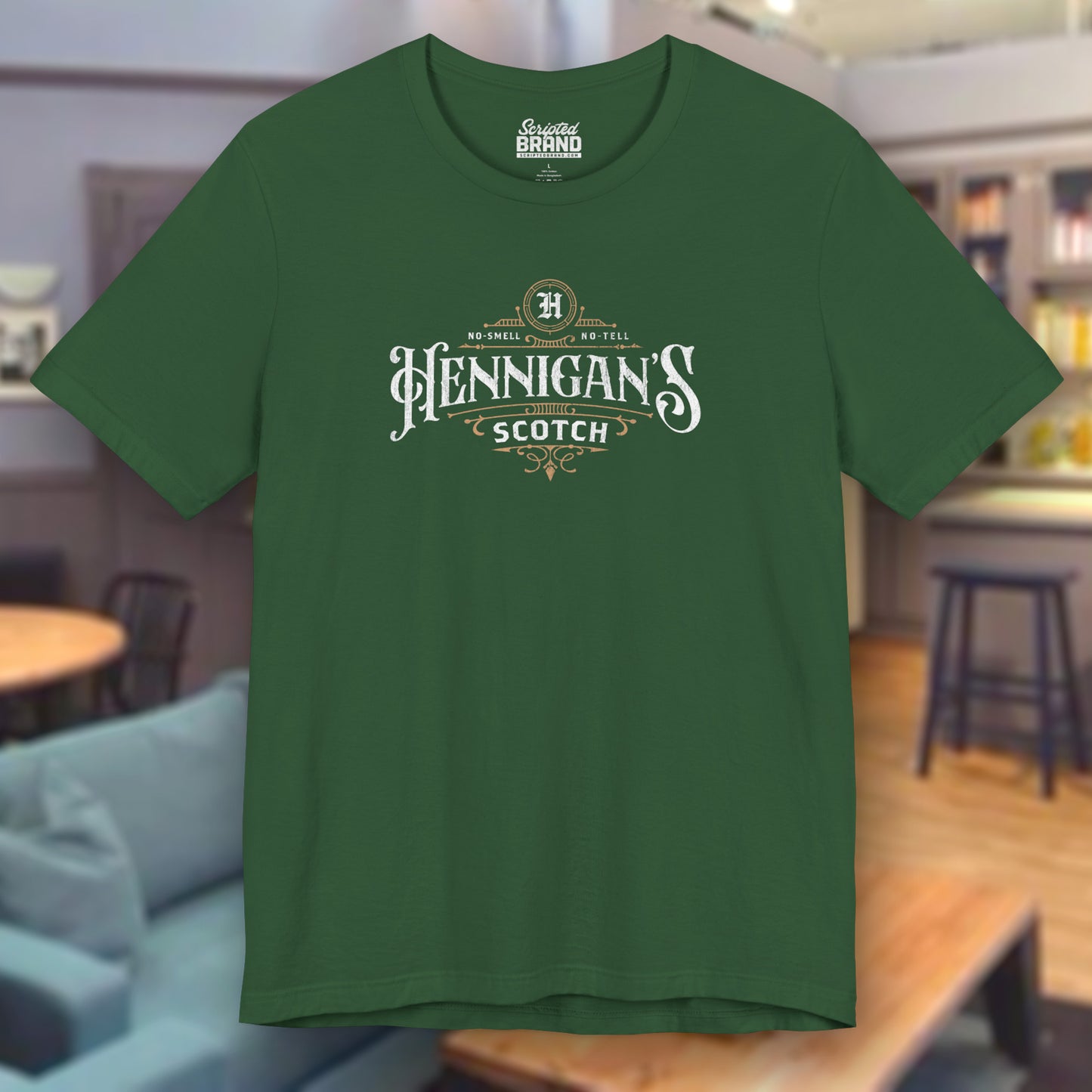 Evergreen colored soft short-sleeve t-shirt featuring a Hennigans Scotch Whisky logo graphic inspired by the TV show Seinfeld in a vintage distressed ink-stamped worn-in style.