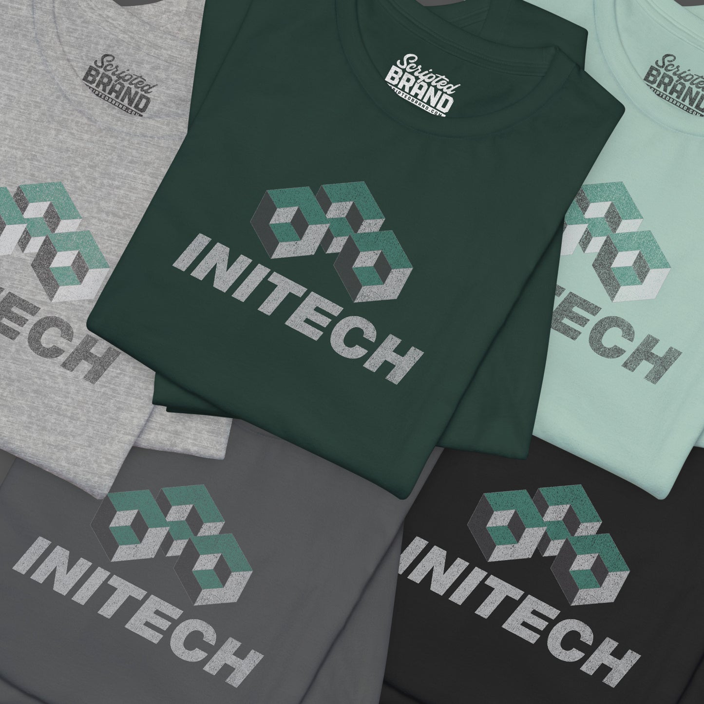Group of 5 folded soft Bella+Canvas 3001 short-sleeve t-shirts featuring the Initech logo from the movie Office Space in a vintage distressed style, sold by ScriptedBrand.
