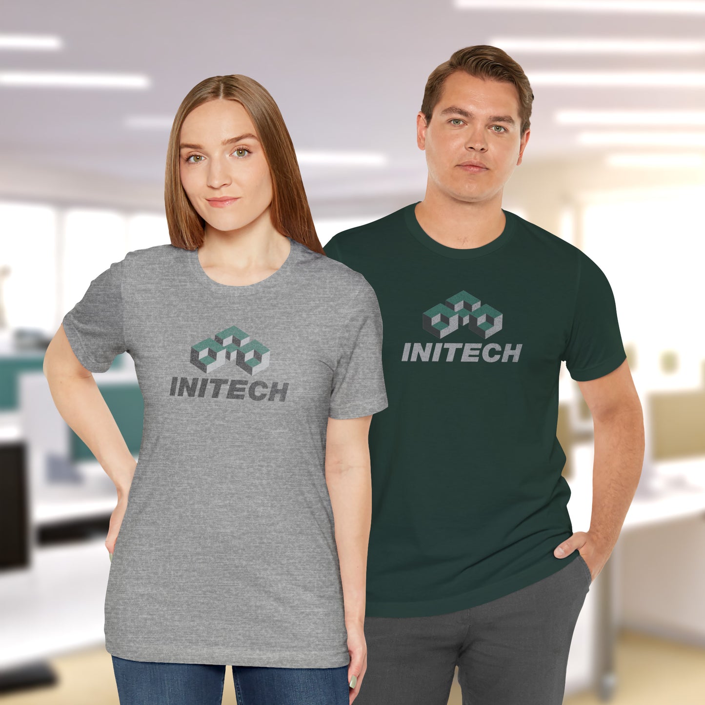 2 models wearing soft Bella+Canvas 3001 short-sleeve t-shirts featuring the Initech logo from the movie Office Space in a vintage distressed style, sold by ScriptedBrand.