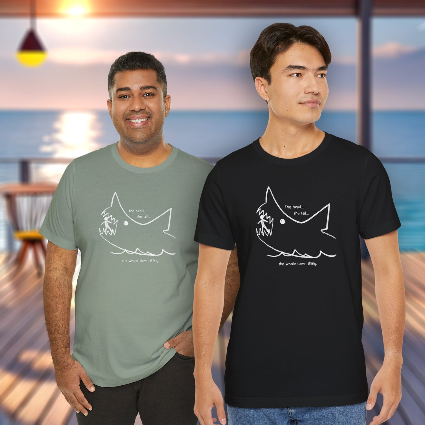 2 male models wearing soft short-sleeve Bella+Canvas 3001 t-shirts featuring the chalkboard drawing of a shark eating a person, drawn by Quint in the movie Jaws.