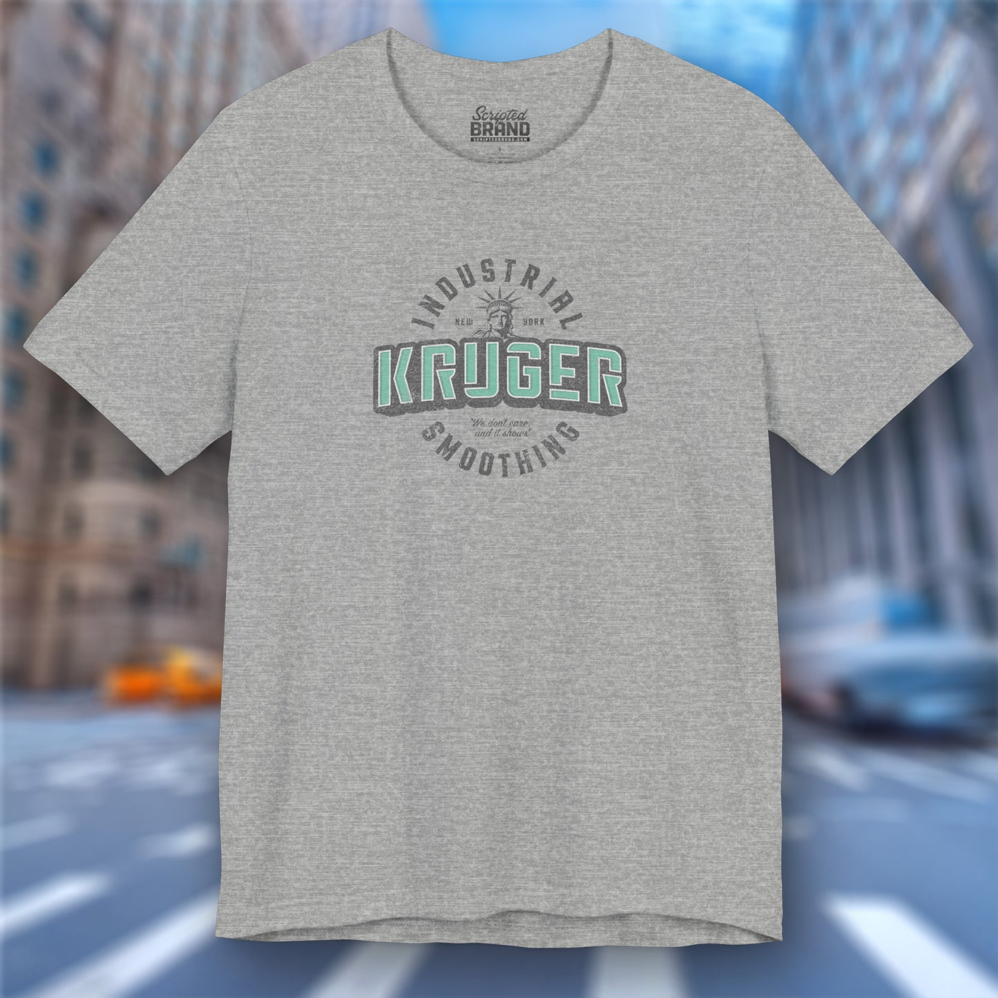 Front view of an athletic heather grey colored Soft unisex Bella+Canvas 3001 short-sleeve t-shirt featuring a Kruger Industrial Smoothing logo graphic in a vintage distressed style, designed by ScriptedBrand, and inspired by the TV show Seinfeld.