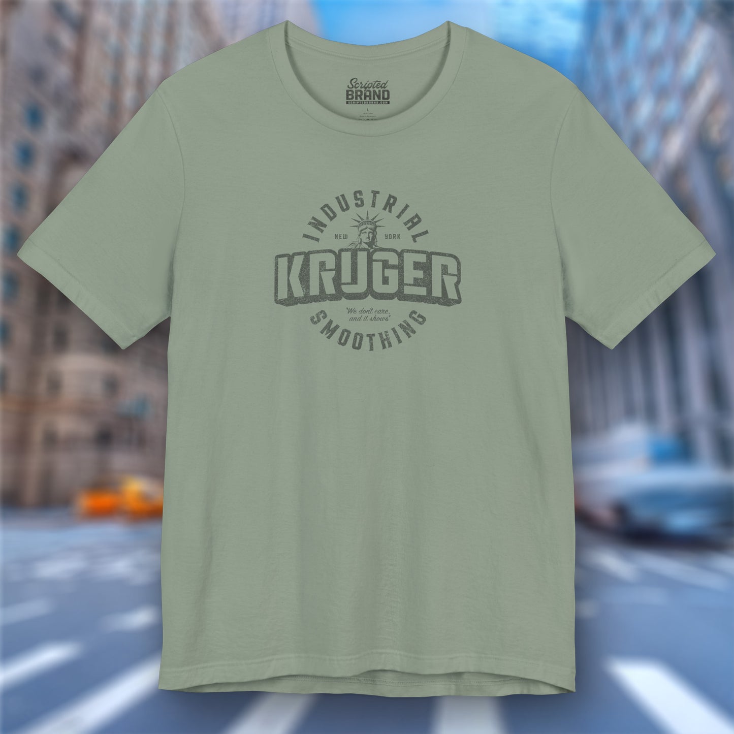 Front view of a sage green colored Soft unisex Bella+Canvas 3001 short-sleeve t-shirt featuring a Kruger Industrial Smoothing logo graphic in a vintage distressed style, designed by ScriptedBrand, and inspired by the TV show Seinfeld.