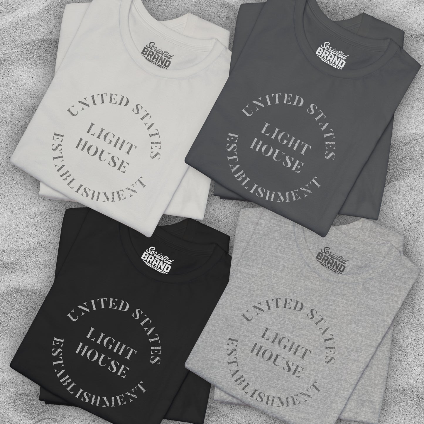 Four folded t-shirts featuring the United States Light House Establishment logo graphic worn by Robert Pattinson in the movie The Lighthouse in a vintage distressed style.