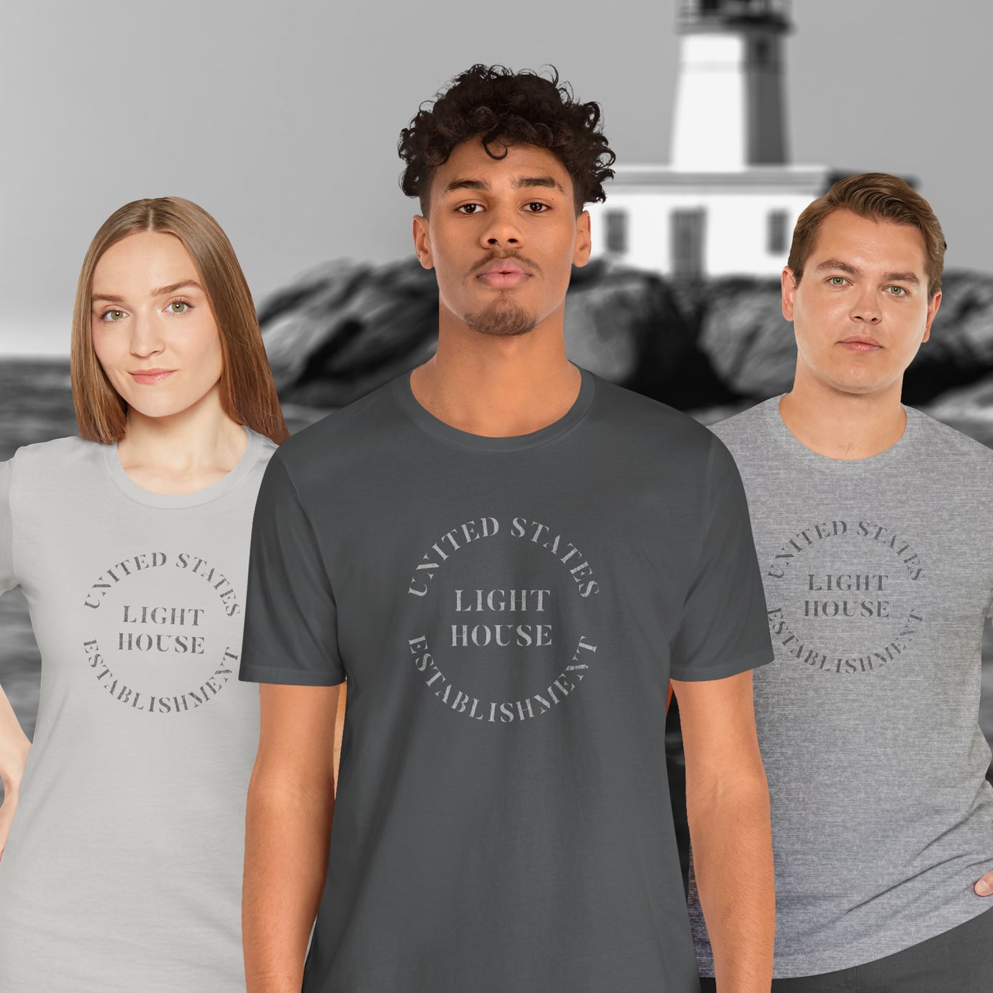 Three people wearing t-shirts featuring the United States Light House Establishment logo graphic worn by Robert Pattinson in the movie The Lighthouse in a vintage distressed style.