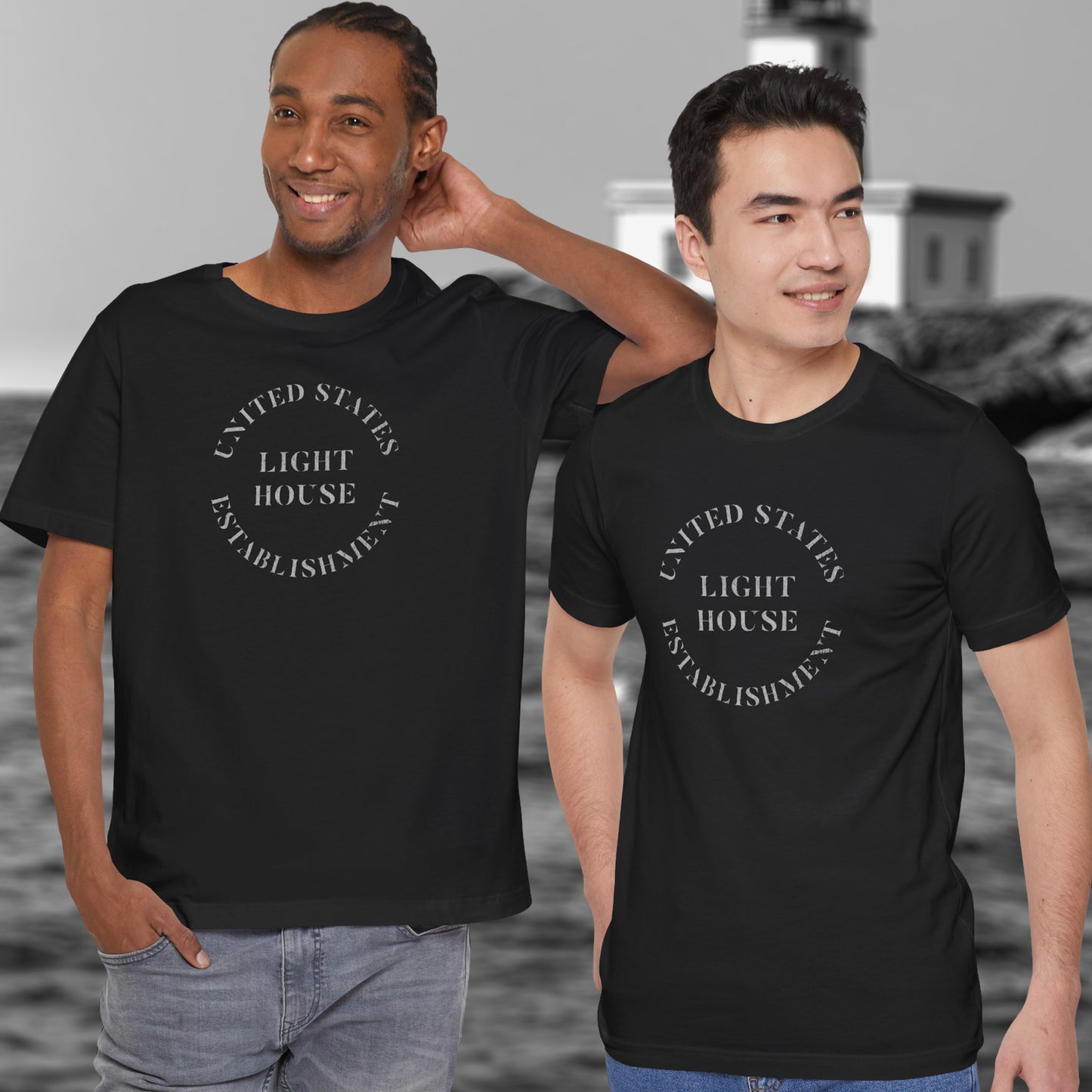 Two men wearing black t-shirts featuring the United States Light House Establishment logo graphic worn by Robert Pattinson in the movie The Lighthouse in a vintage distressed style.
