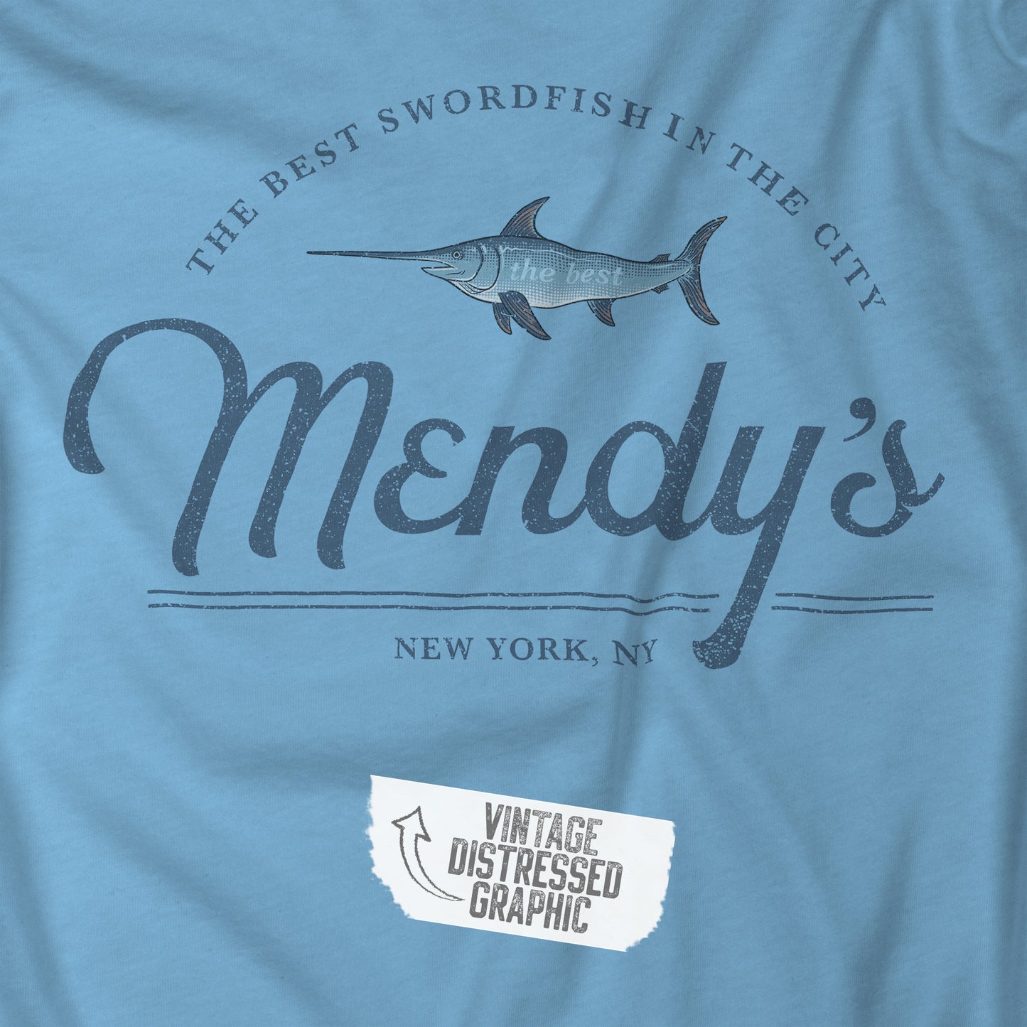 Closeup view of an ocean blue colored soft unisex Bella+Canvas 3001 short-sleeve t-shirt featuring a unique Mendy's Restaurant logo graphic, designed by ScriptedBrand in a vintage distressed style, and inspired by the TV show Seinfeld.