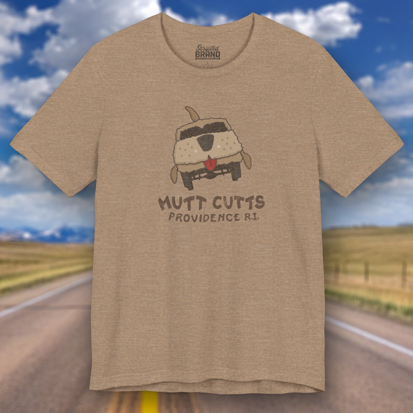 Front view of a heather tan colored Soft unisex Bella+Canvas 3001 short-sleeve t-shirt featuring a Mutt Cutts logo graphic inspired by the movie Dumb and Dumber, illustrated by ScriptedBrand in a vintage distressed style.