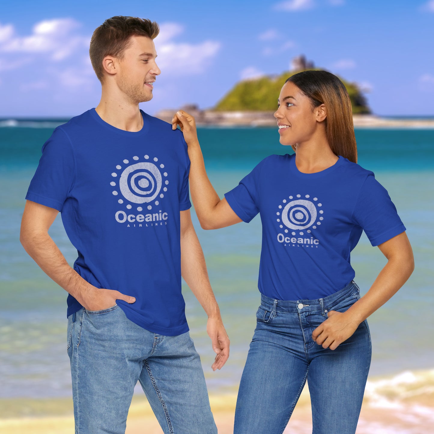 Two people wearing blue t-shirts featuring the Oceanic Airlines logo graphic from the TV show LOST in a vintage distressed style.