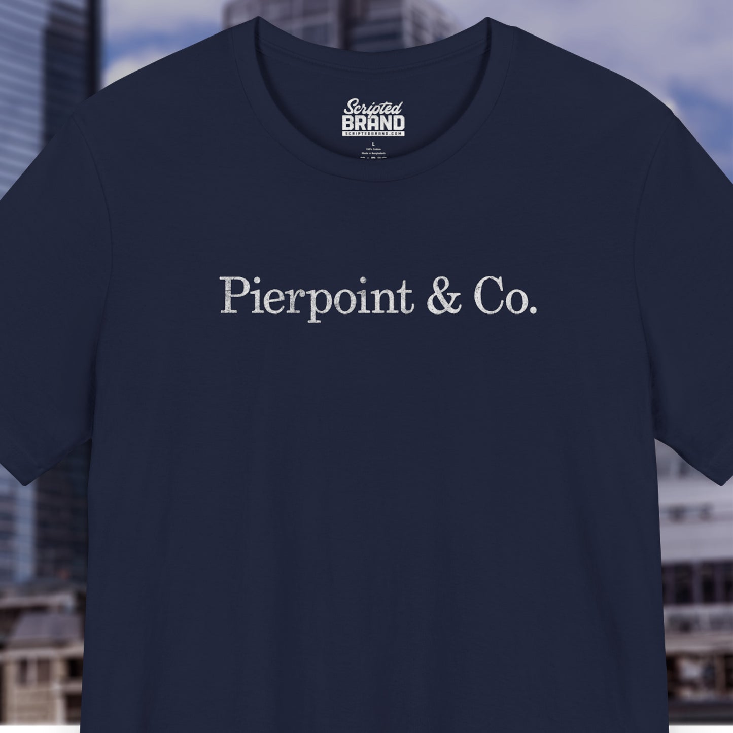 Front view of a navy blue soft short-sleeve Bella+Canvas 3001 t-shirt featuring the fictional logo Pierpoint & Co from the HBO TV show Industry in a vintage distressed style, sold by ScriptedBrand.