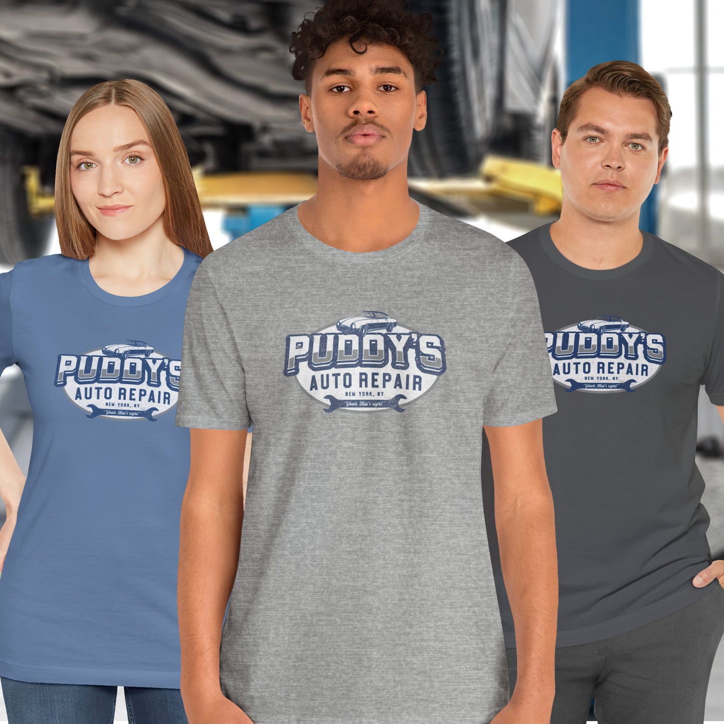 3 models wearing Soft short-sleeve t-shirts featuring a Puddy's Auto Repair graphic designed by ScriptedBrand inspired by the TV show Seinfeld in a vintage distressed ink-stamped worn-in style.
