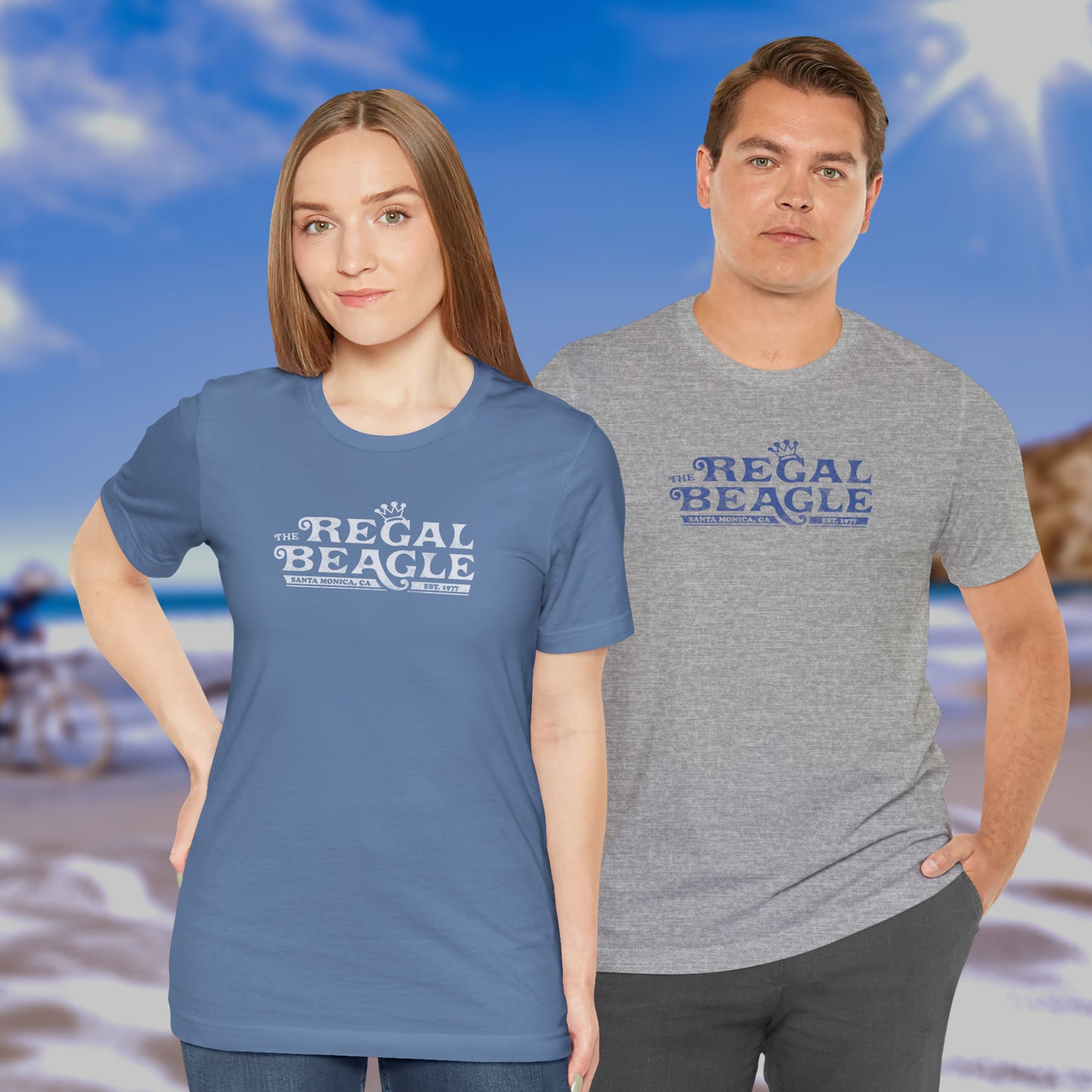 2 models wearing soft Bella+Canvas 3001 short-sleeve t-shirts featuring the Regal Beagle logo from the TV Show Threes Company in a vintage distressed style.