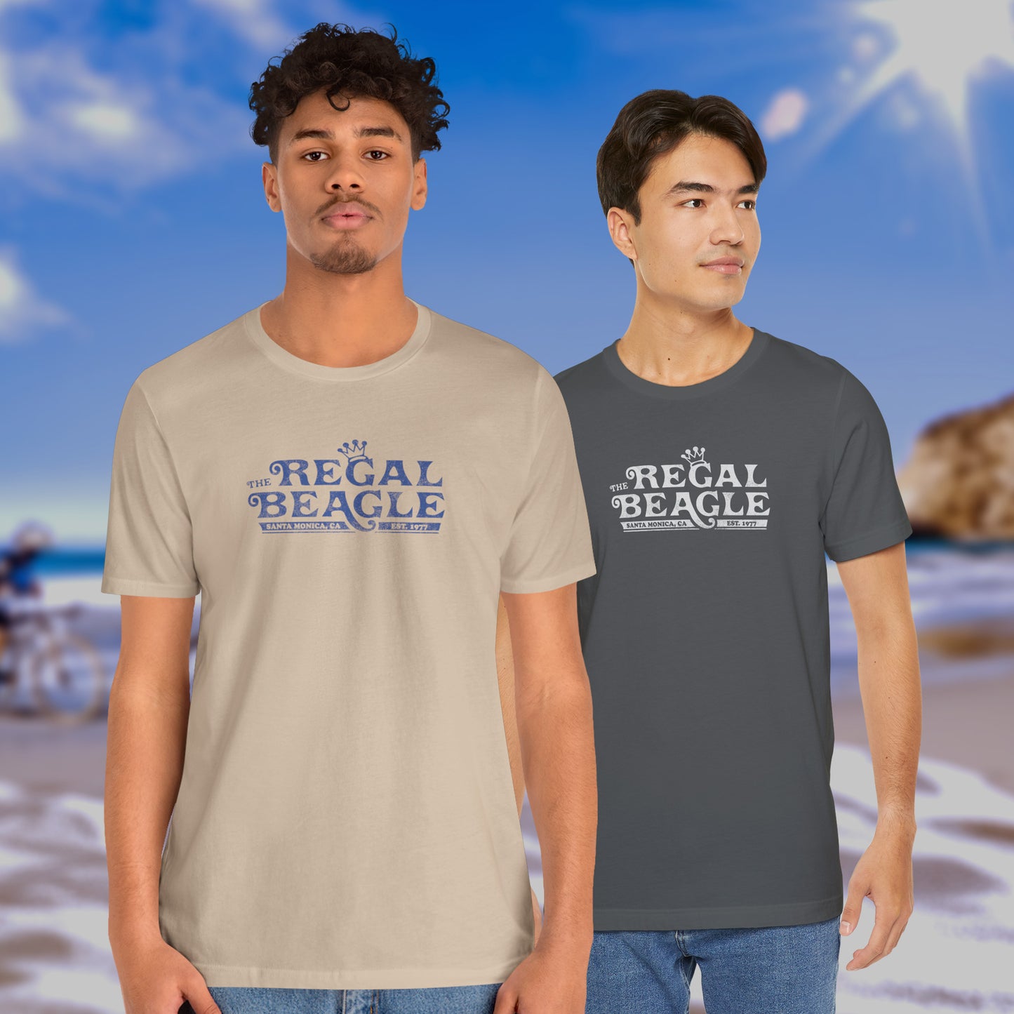 2 male models wearing soft Bella+Canvas 3001 short-sleeve t-shirts featuring the Regal Beagle logo from the TV Show Threes Company in a vintage distressed style.