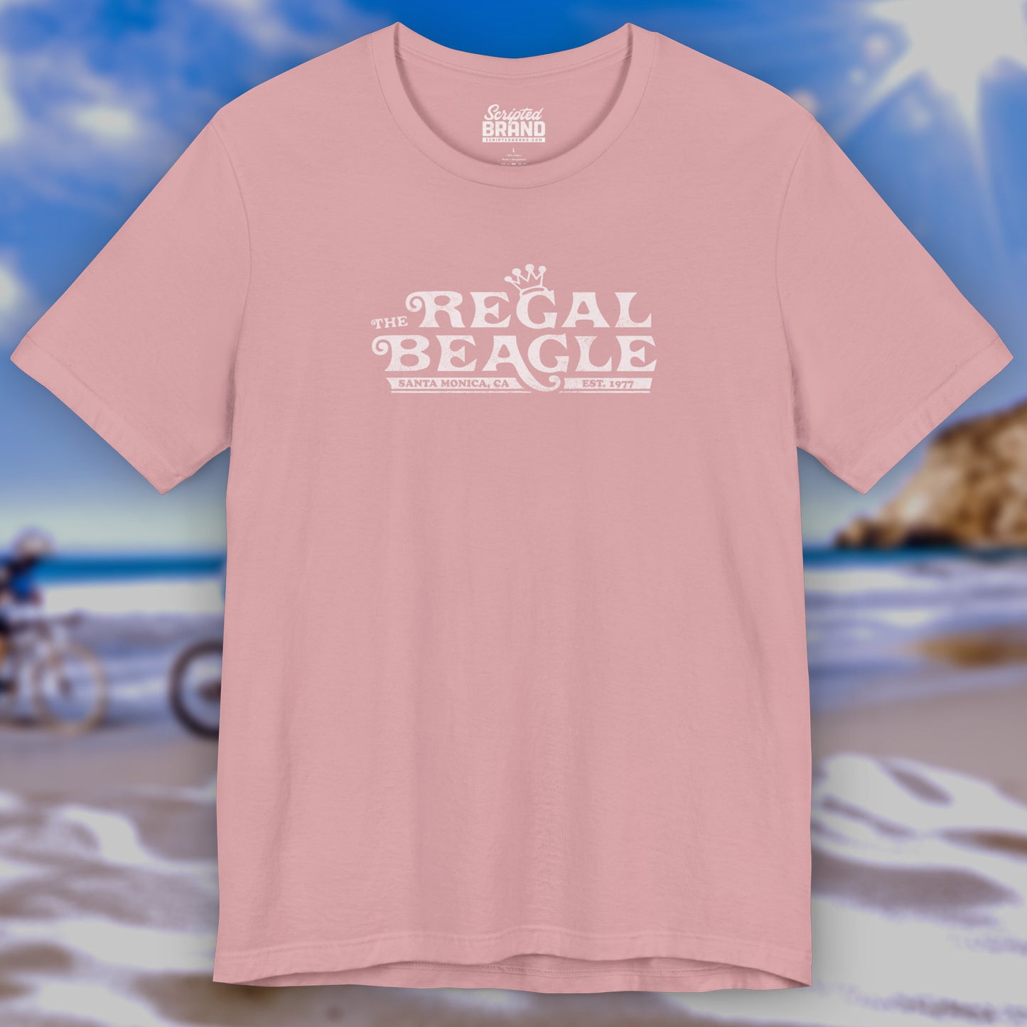 Front view of an orchid pink colored soft Bella+Canvas 3001 short-sleeve t-shirt featuring the Regal Beagle logo from the TV Show Threes Company in a vintage distressed style.