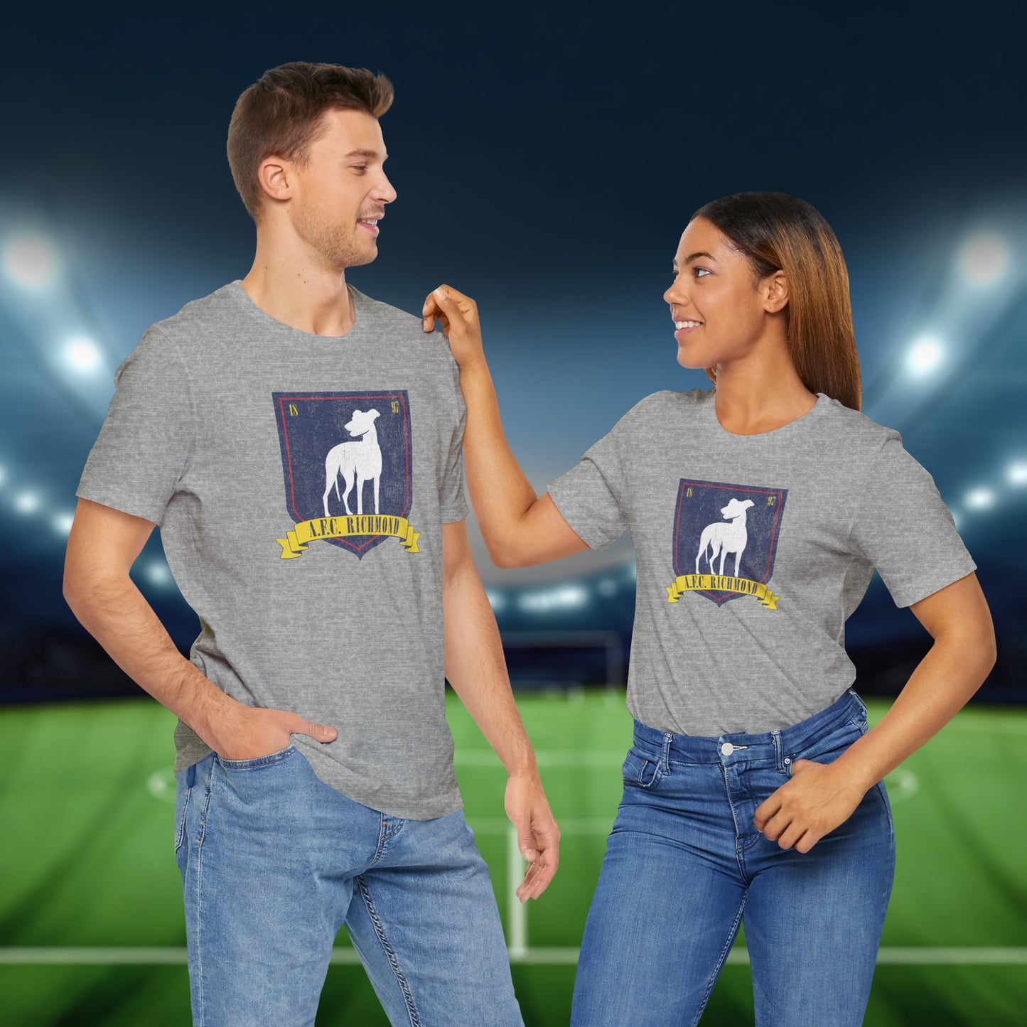 2 models wearing athletic heather grey soft Bella+Canvas 3001 short-sleeve t-shirts featuring the logo graphic of the fictional English soccer team AFC Richmond inspired by the TV show Ted Lasso in a vintage distressed style, sold by ScriptedBrand.
