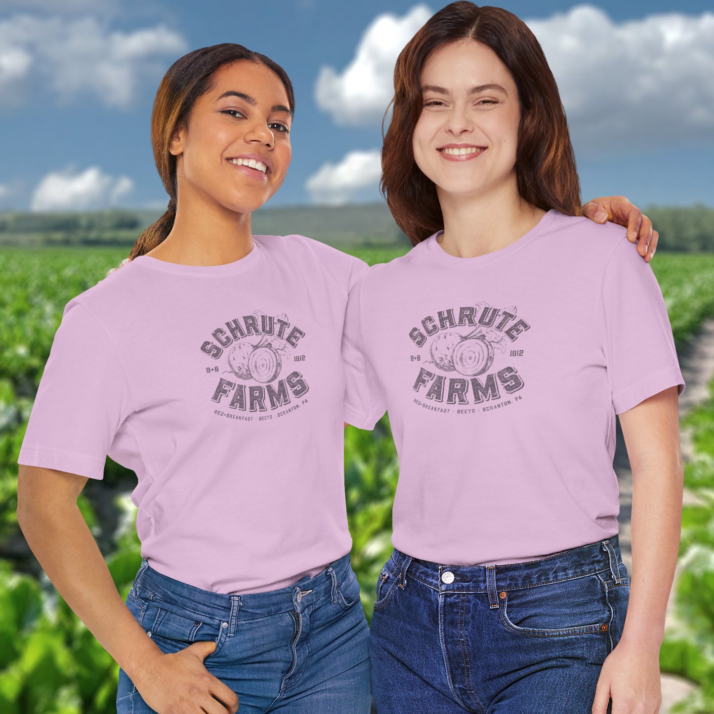 Two people wearing Lilac t-shirts featuring a Schrute Farms logo from the TV show The Office designed by ScriptedBrand in a vintage distressed style.