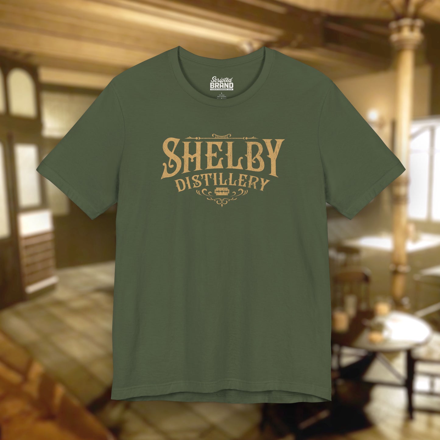 Front view of a military green Soft Bella+Canvas 3001 short-sleeve t-shirt featuring the Shelby Company Limited Distillery Logo Graphic inspired by the TV show and movie Peaky Blinders in a vintage distressed style, sold by ScriptedBrand.