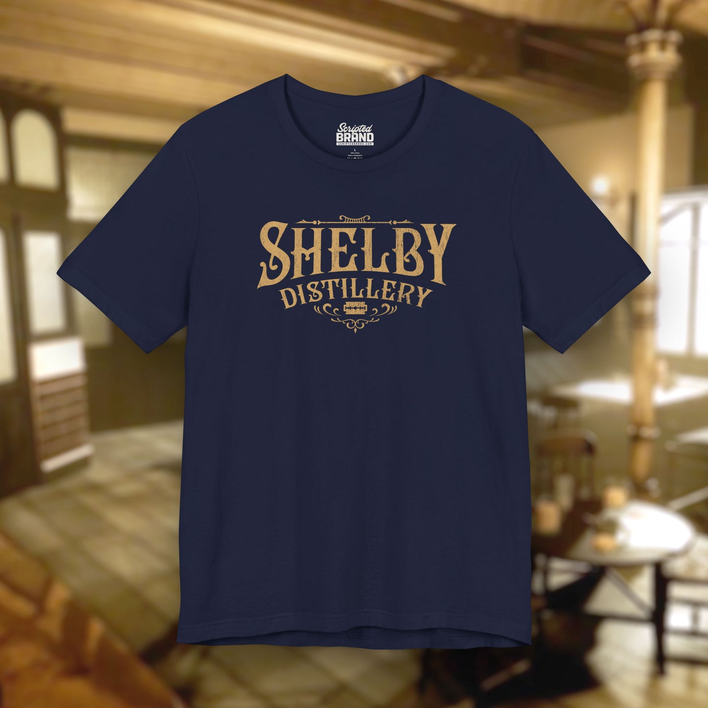 Front view of a navy blue Soft Bella+Canvas 3001 short-sleeve t-shirt featuring the Shelby Company Limited Distillery Logo Graphic inspired by the TV show and movie Peaky Blinders in a vintage distressed style, sold by ScriptedBrand.
