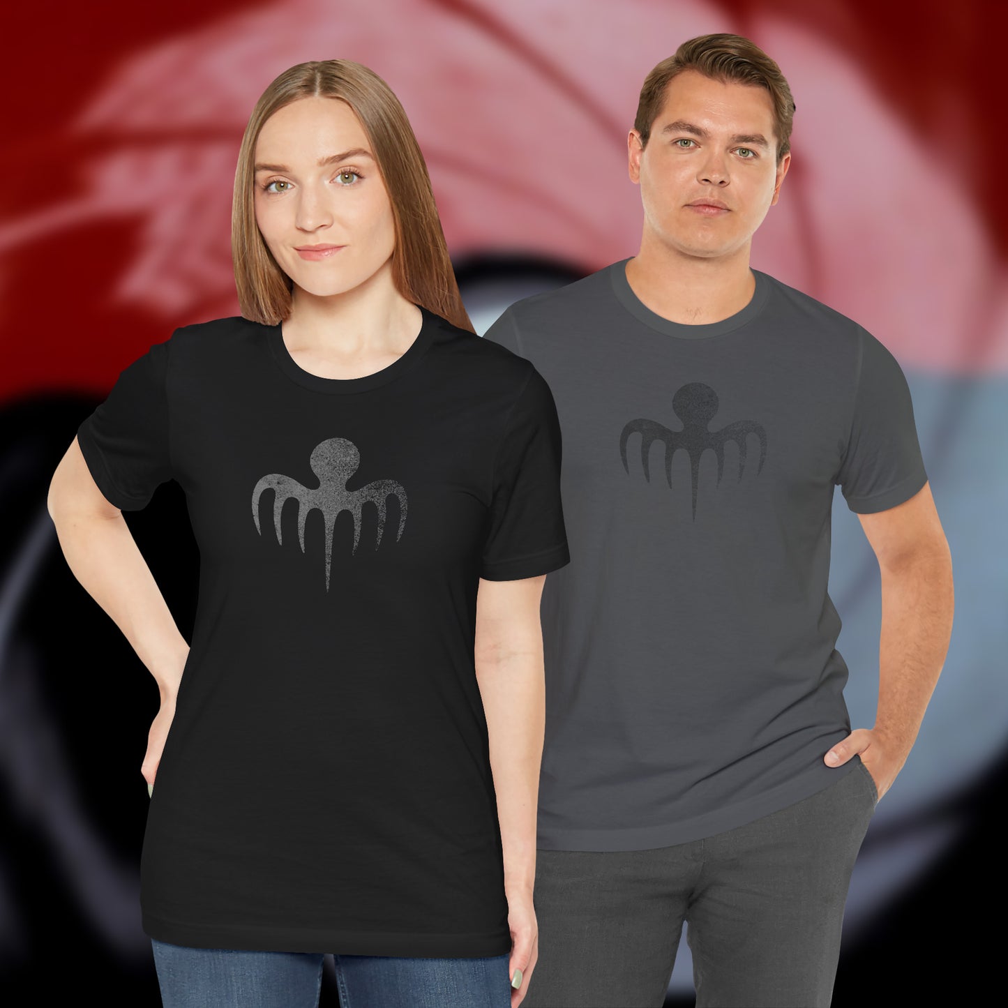 2 models wearing black and grey colored soft Bella+Canvas 3001 short-sleeve t-shirts featuring a logo graphic of the fictional criminal organization Spectre, inspired by the James Bond movie franchise, in a vintage distressed style.
