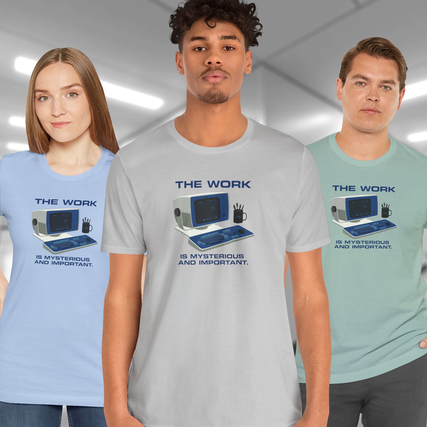 3 models wearing Soft Bella+Canvas shirtsleeve t-shirts featuring the retro computer workstation from the Apple TV show Severance, and includes the text The Work is Mysterious and Important. Graphic is designed and illustrated by ScriptedBrand.