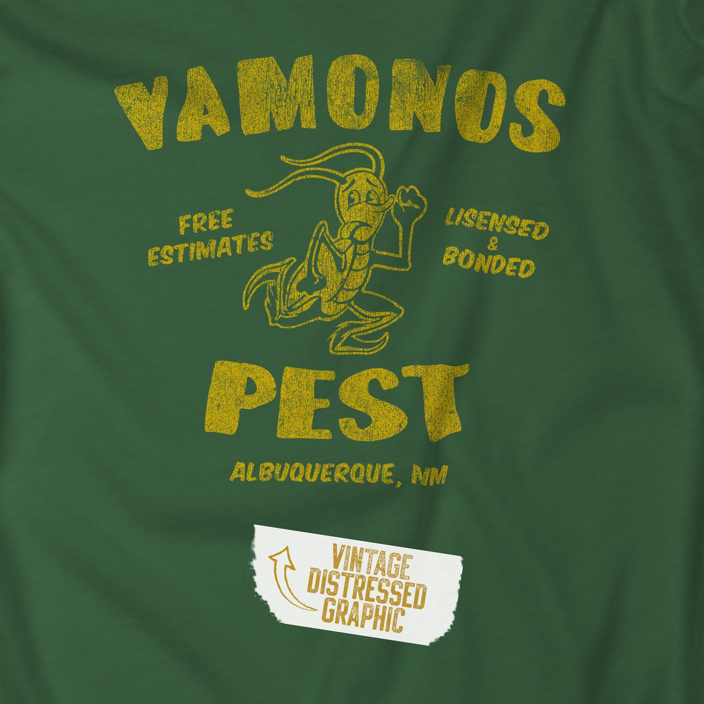Closeup view of an evergreen colored soft Bella+Canvas 3001 short-sleeve t-shirt featuring the Vamonos Pest Exterminators logo from the TV show Breaking Bad in a vintage distressed style, sold by ScriptedBrand.
