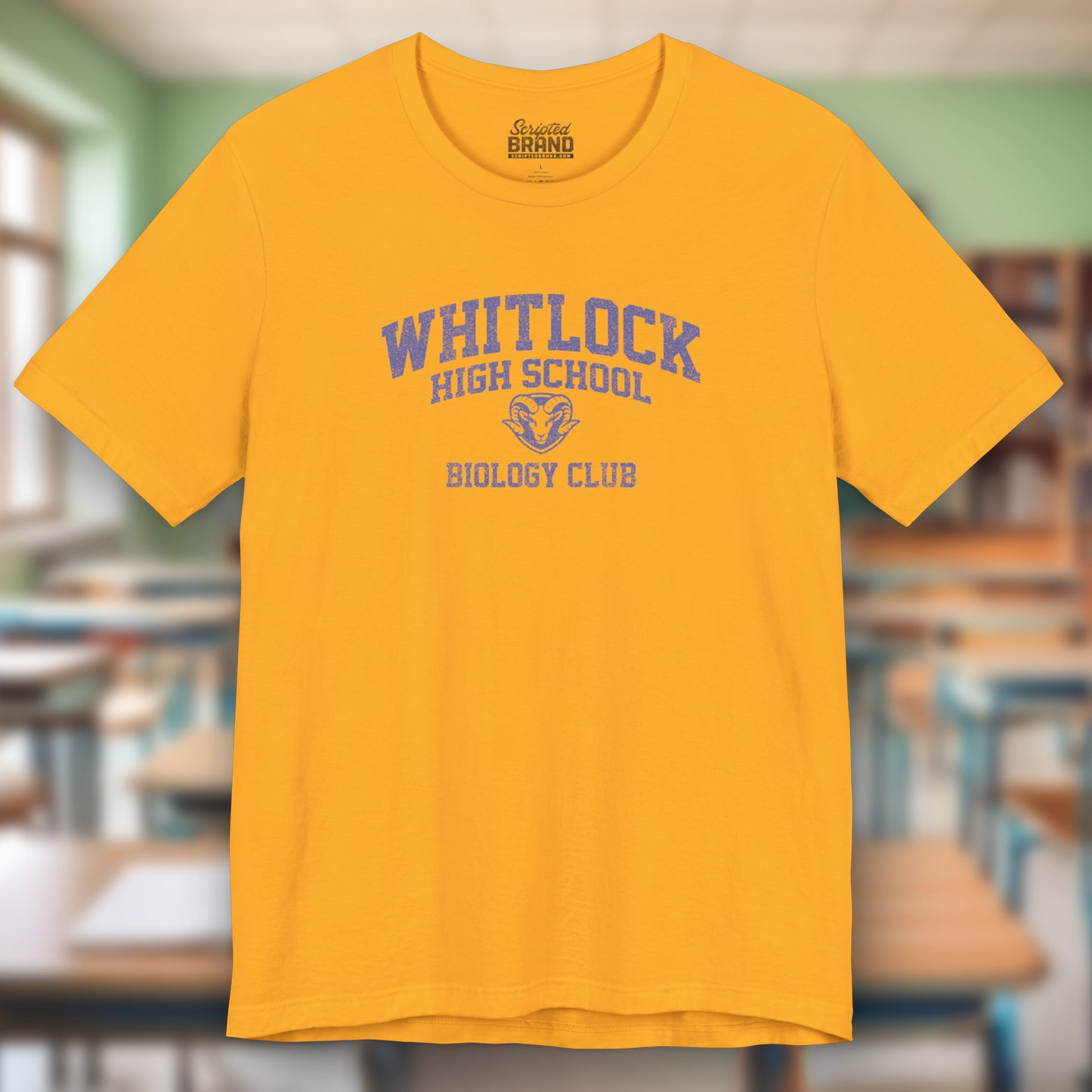 Gold t-shirt featuring blue Whitlock High School Rams logo graphic inspired by the TV show AP Bio in a vintage style.