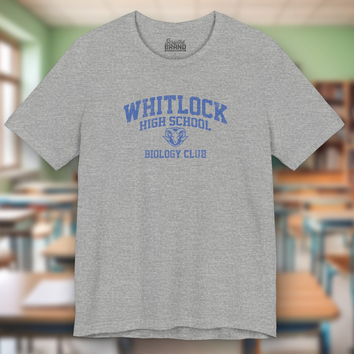 Gray t-shirt featuring gold Whitlock High School Rams logo graphic inspired by the TV show AP Bio in a vintage style.