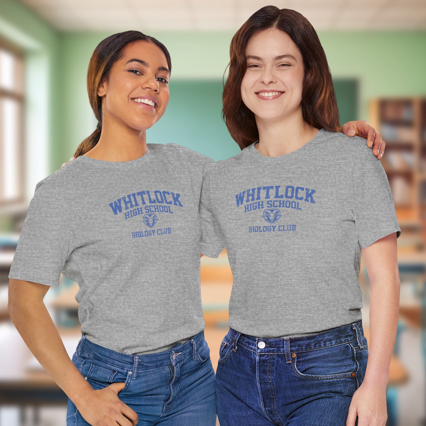 Two women wearing gray t-shirts featuring gold Whitlock High School Rams logo graphic inspired by the TV show AP Bio in a vintage style.