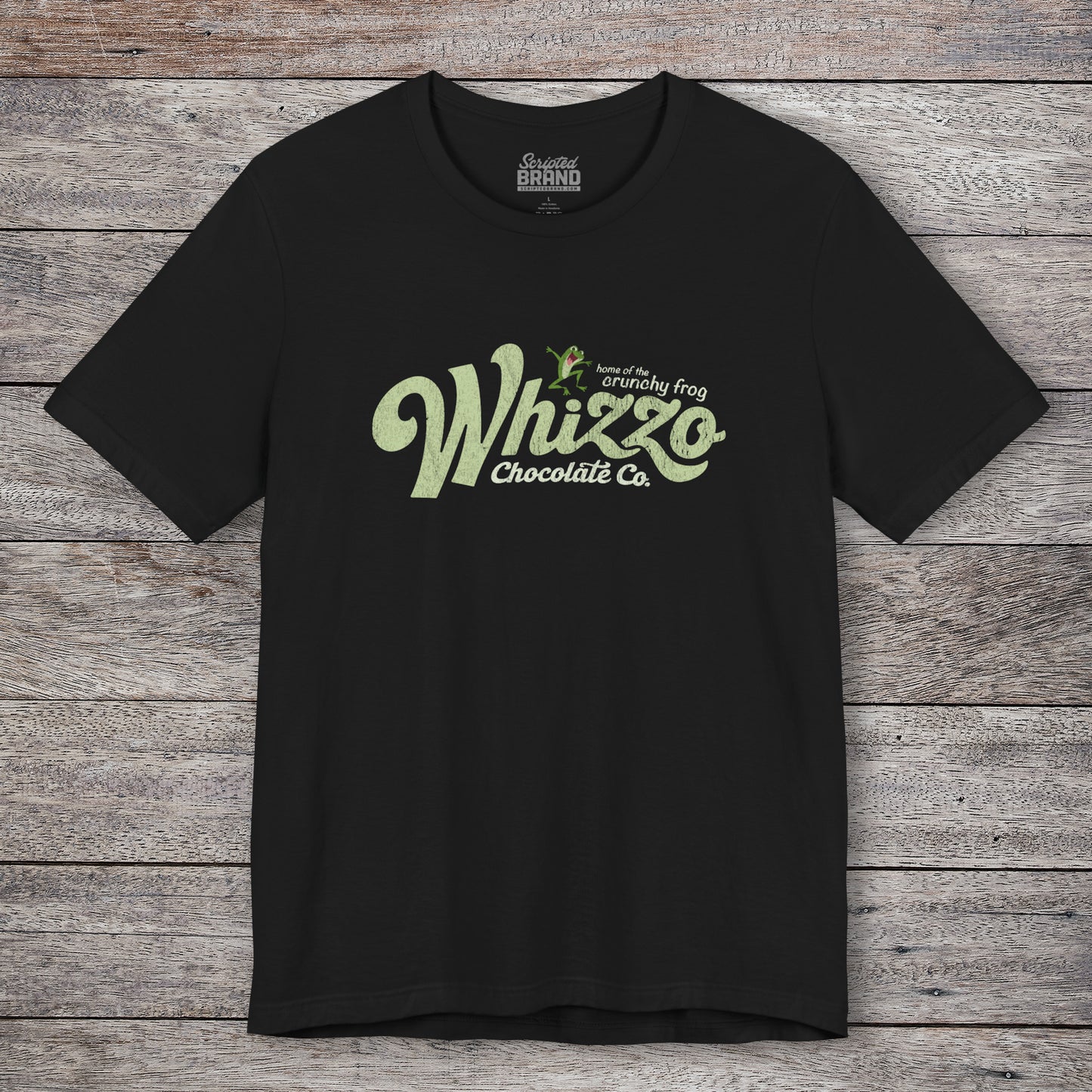 Black t-shirt with vintage Whizzo Chocolate Co. logo, inspired by Monty Python, featuring “home of the crunchy frog” graphic.